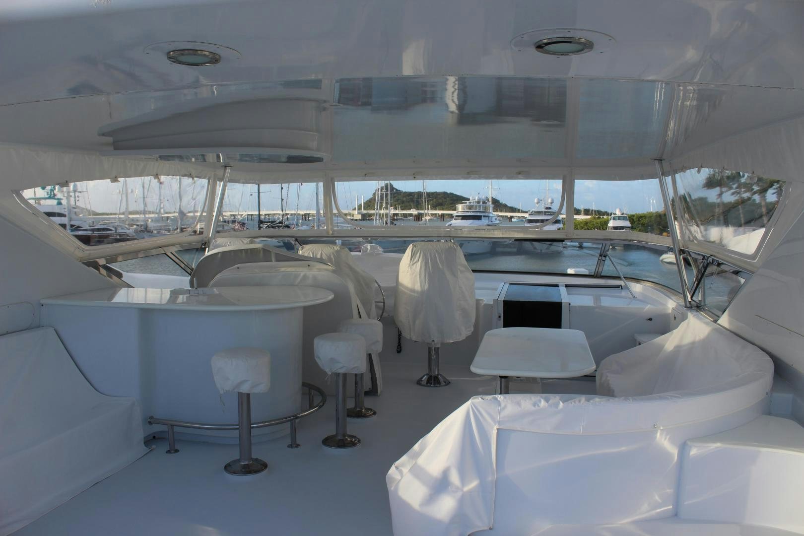 a room with tables and chairs aboard No Name Yacht for Sale