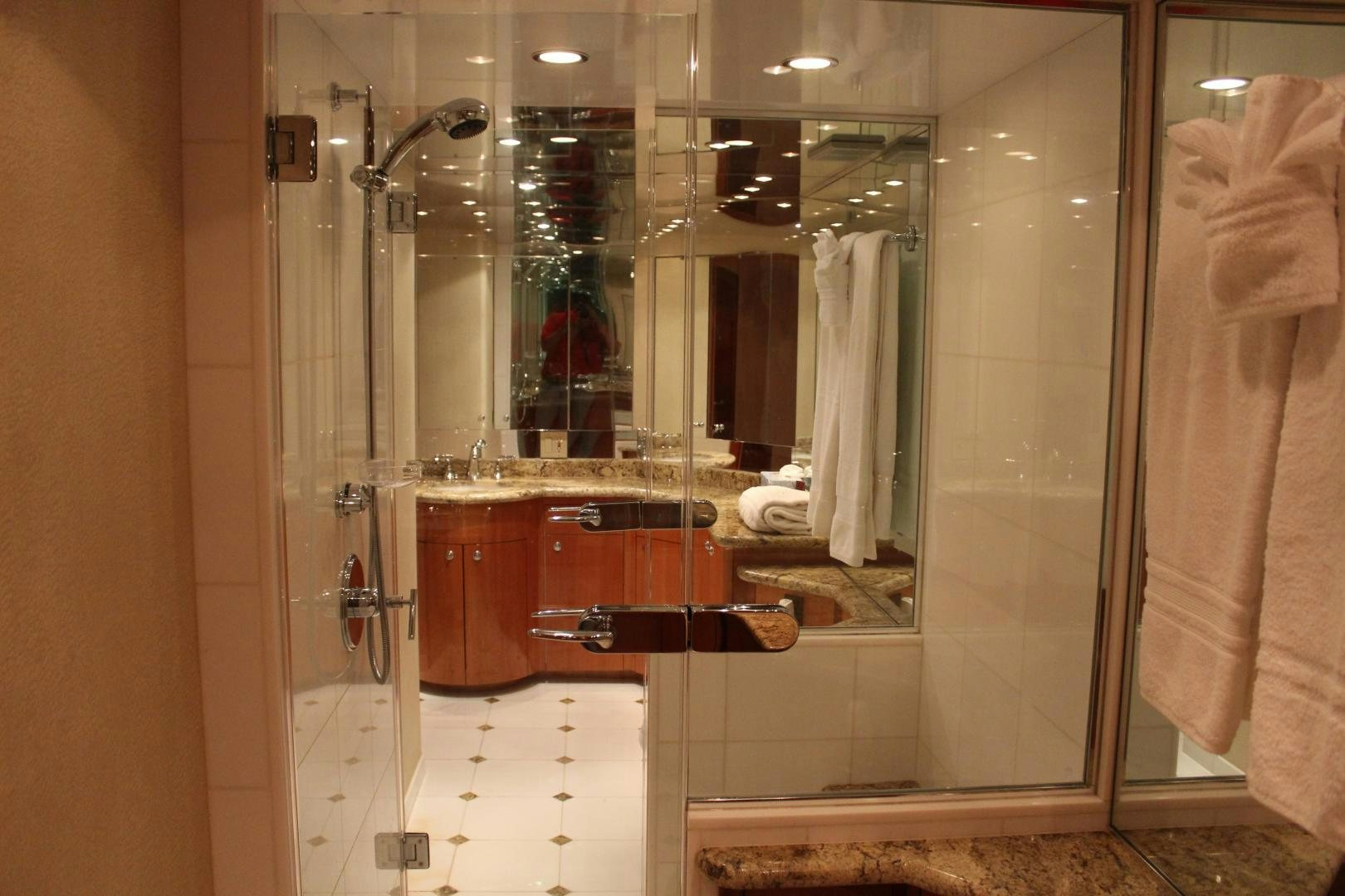 a bathroom with a large glass shower aboard No Name Yacht for Sale