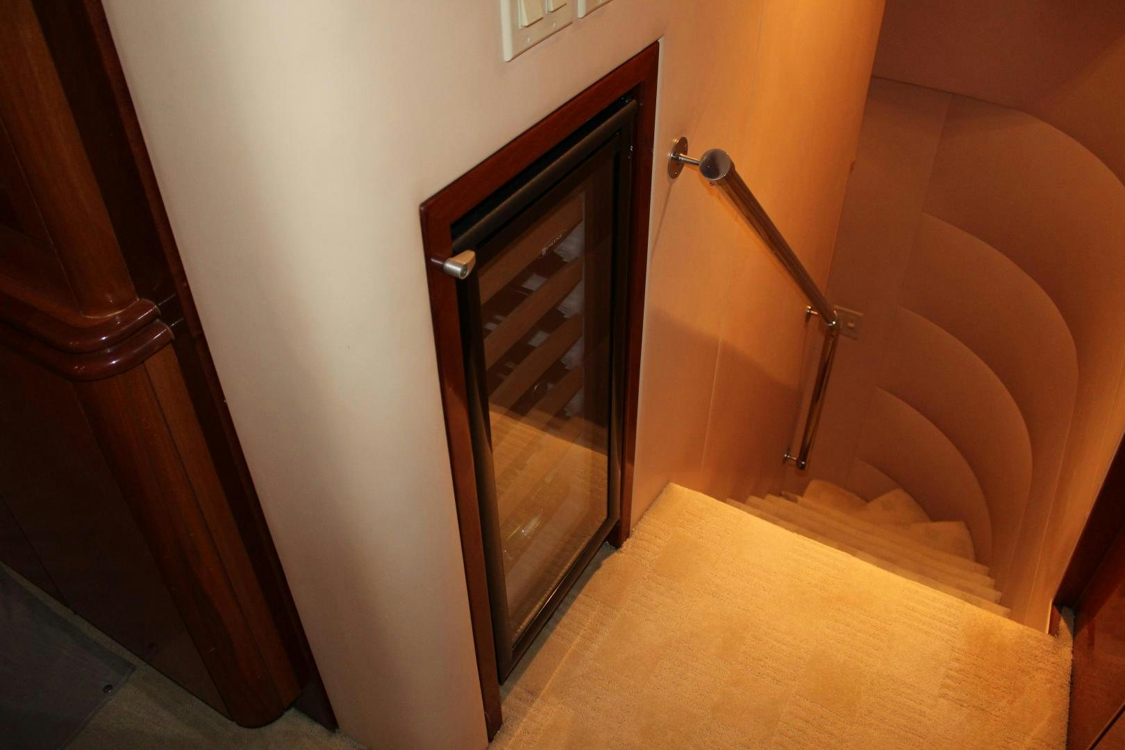 a bathroom with a shower and a wood cabinet aboard No Name Yacht for Sale