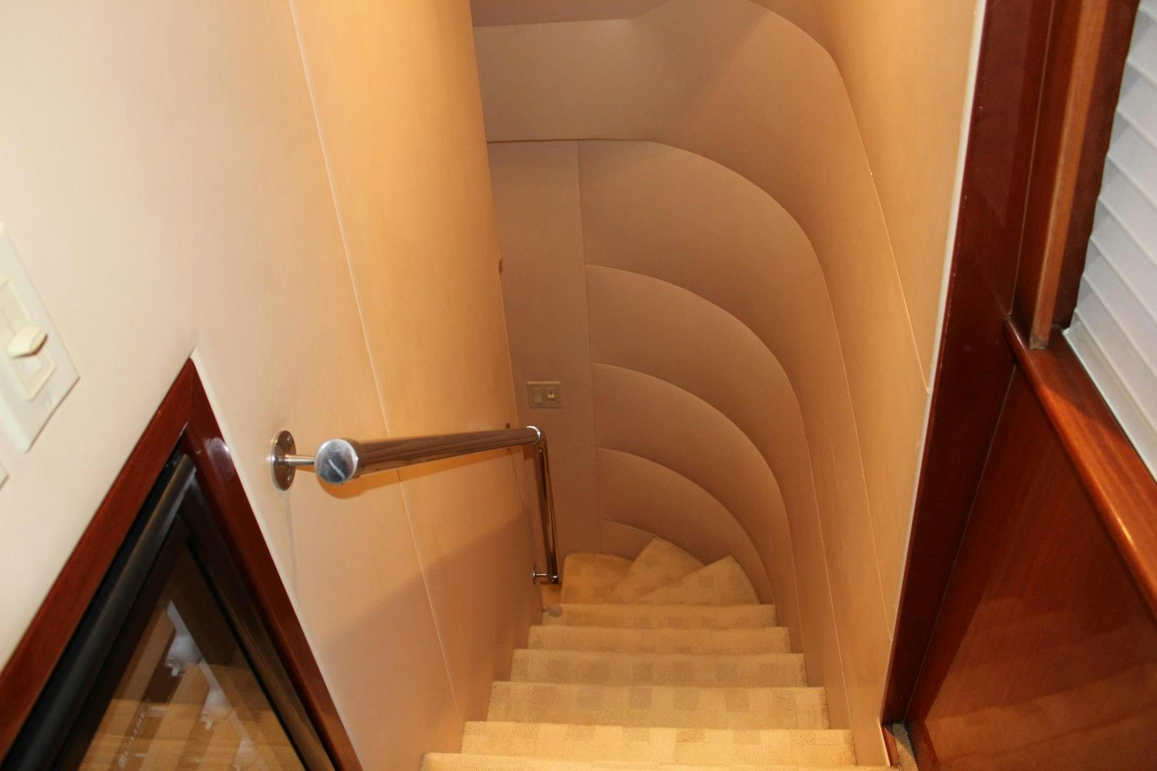 a staircase with a railing aboard No Name Yacht for Sale