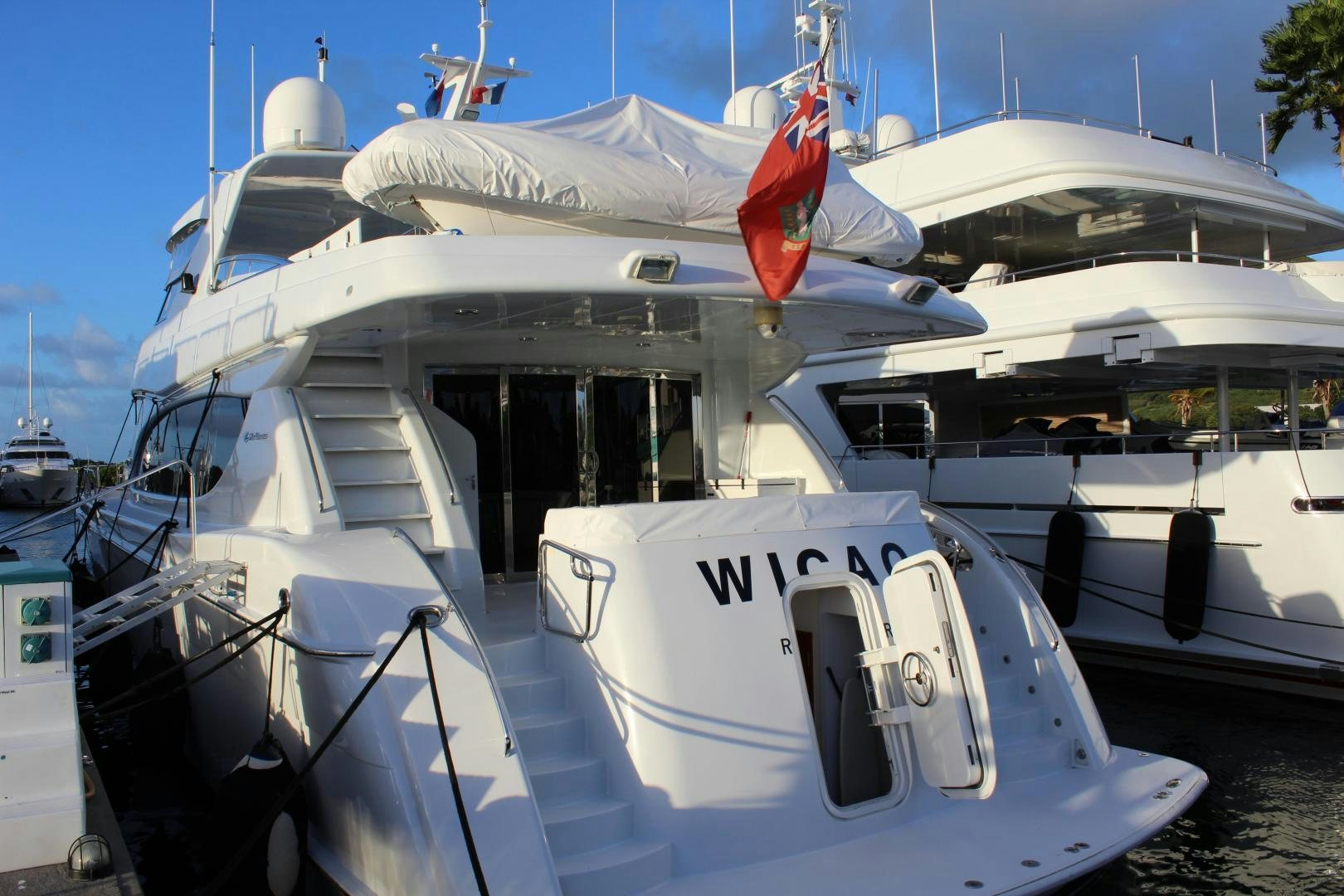 a boat with a flag on the front aboard No Name Yacht for Sale