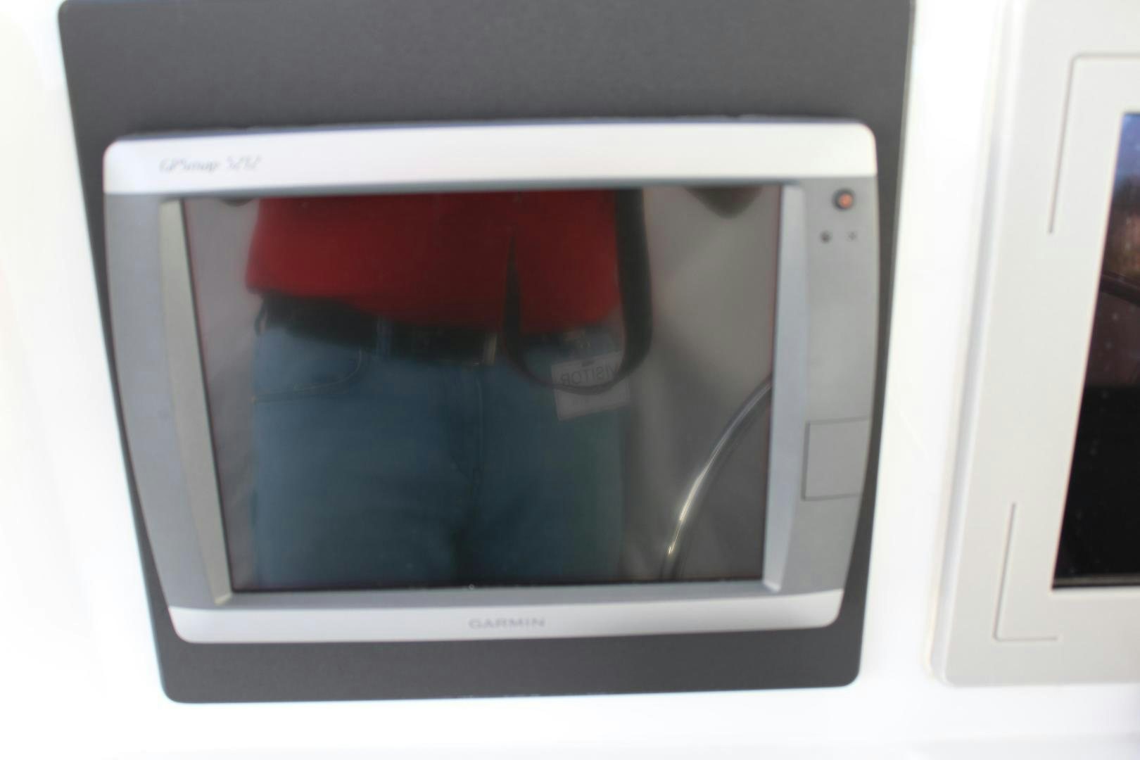a person's legs through a window aboard No Name Yacht for Sale