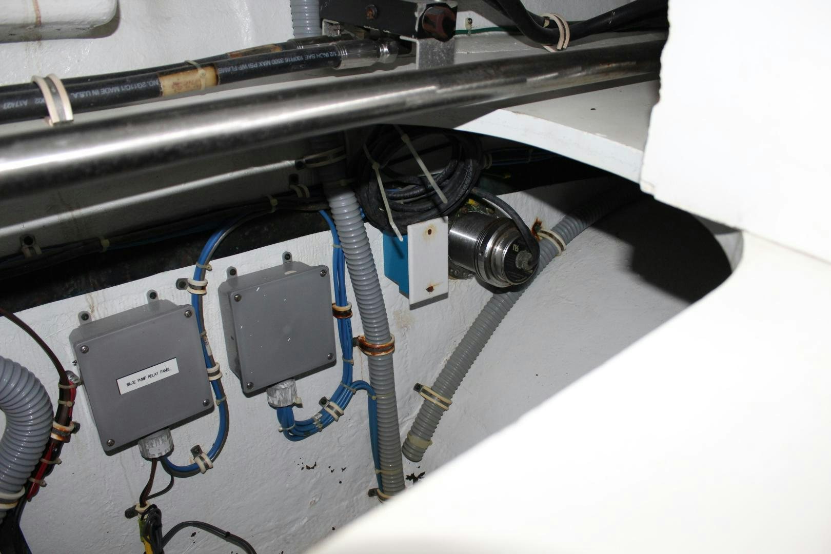 a car engine with a blue handle aboard No Name Yacht for Sale