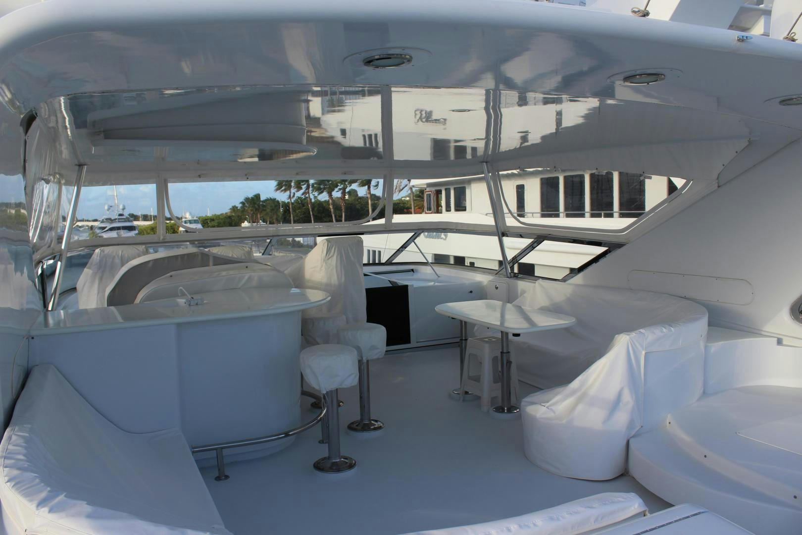 a large white yacht with chairs aboard No Name Yacht for Sale
