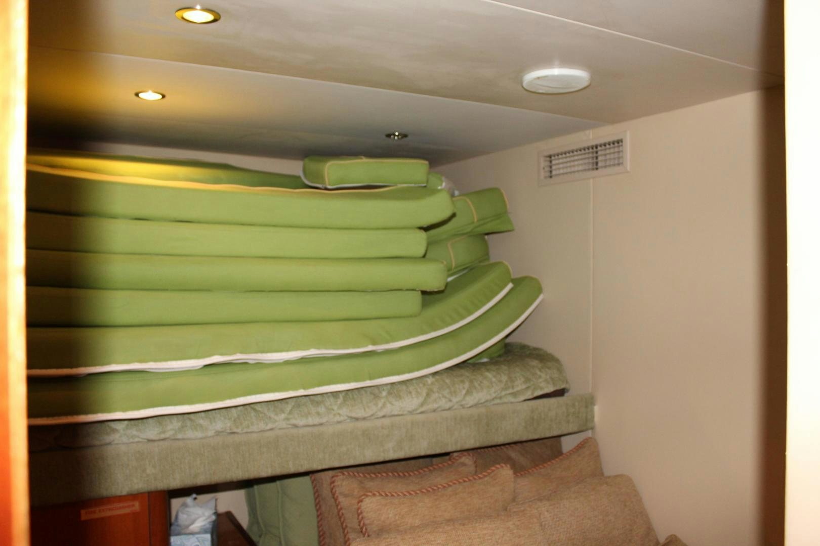 a green staircase in a building aboard No Name Yacht for Sale