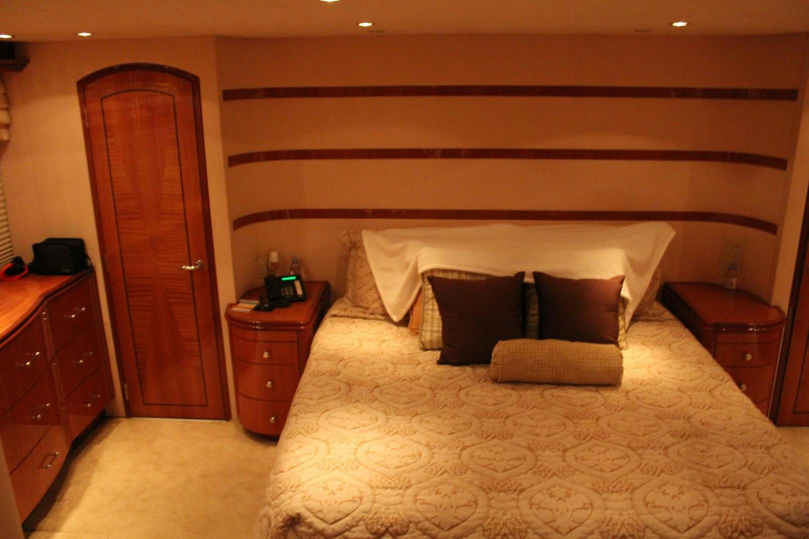 a bed with white sheets and pillows aboard No Name Yacht for Sale