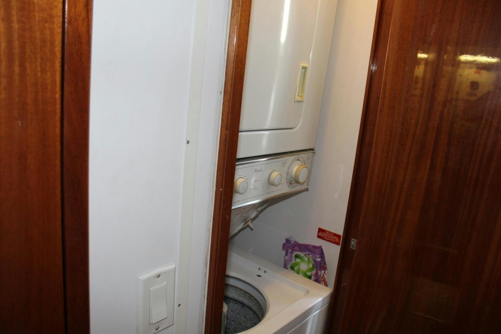 a small kitchen with a white stove aboard No Name Yacht for Sale