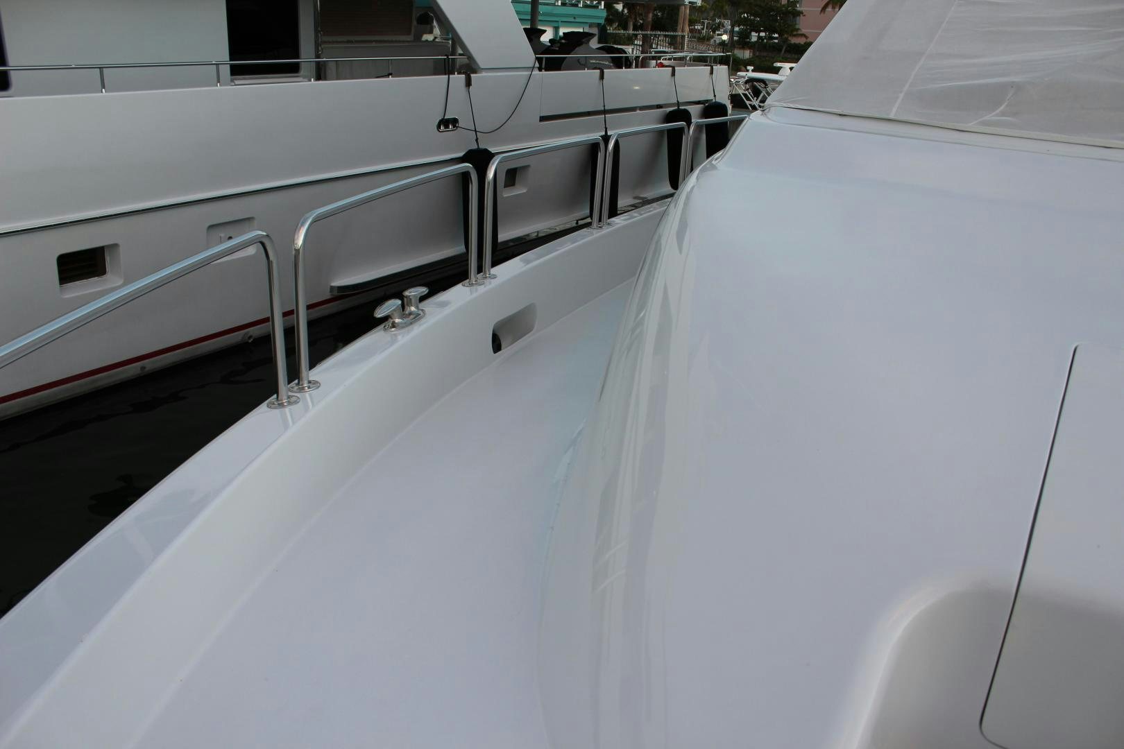 a white boat with a railing aboard No Name Yacht for Sale