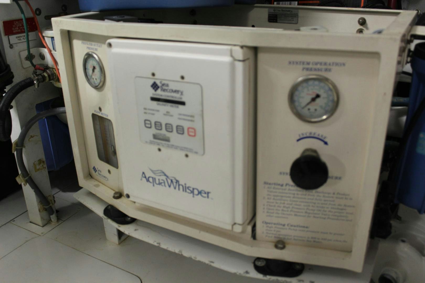 a white machine with a round dial aboard No Name Yacht for Sale