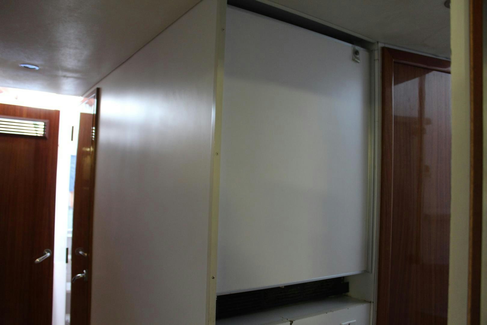 a room with a whiteboard aboard No Name Yacht for Sale