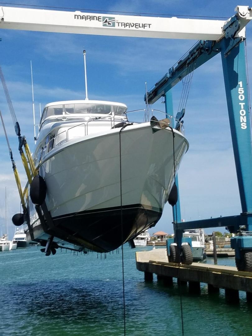 a large boat docked at a pier aboard No Name Yacht for Sale