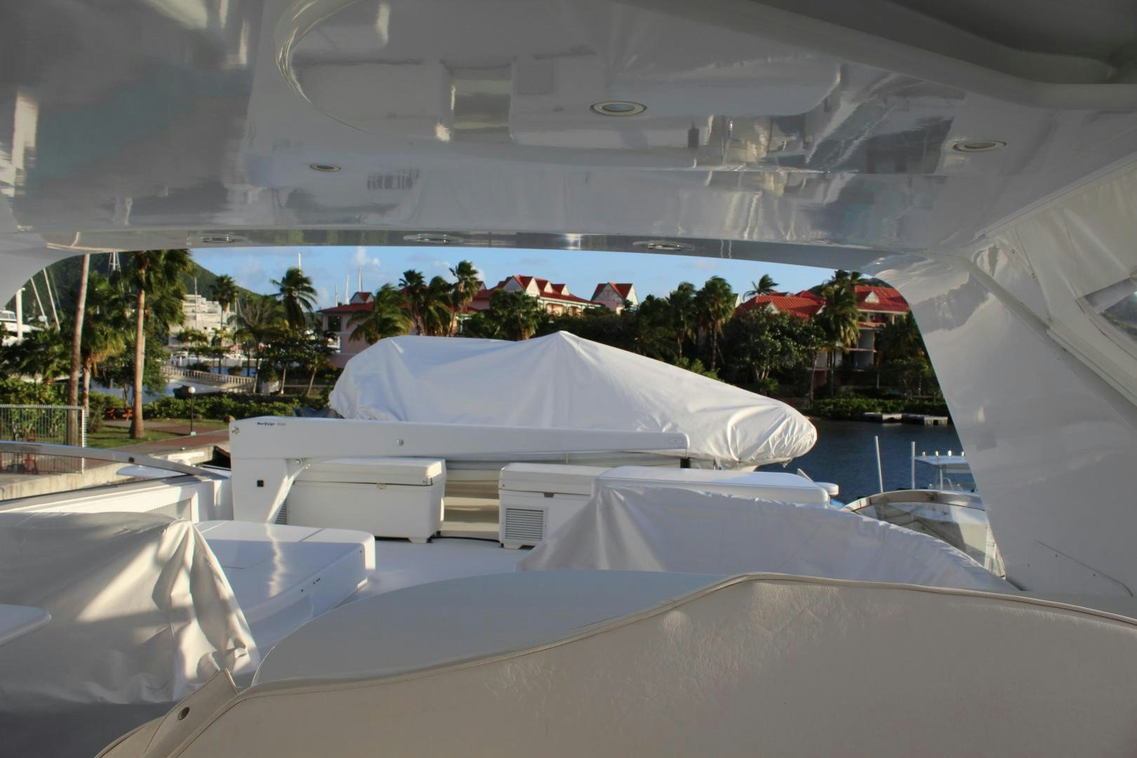 a large white tent with a red roof and a white roof aboard No Name Yacht for Sale