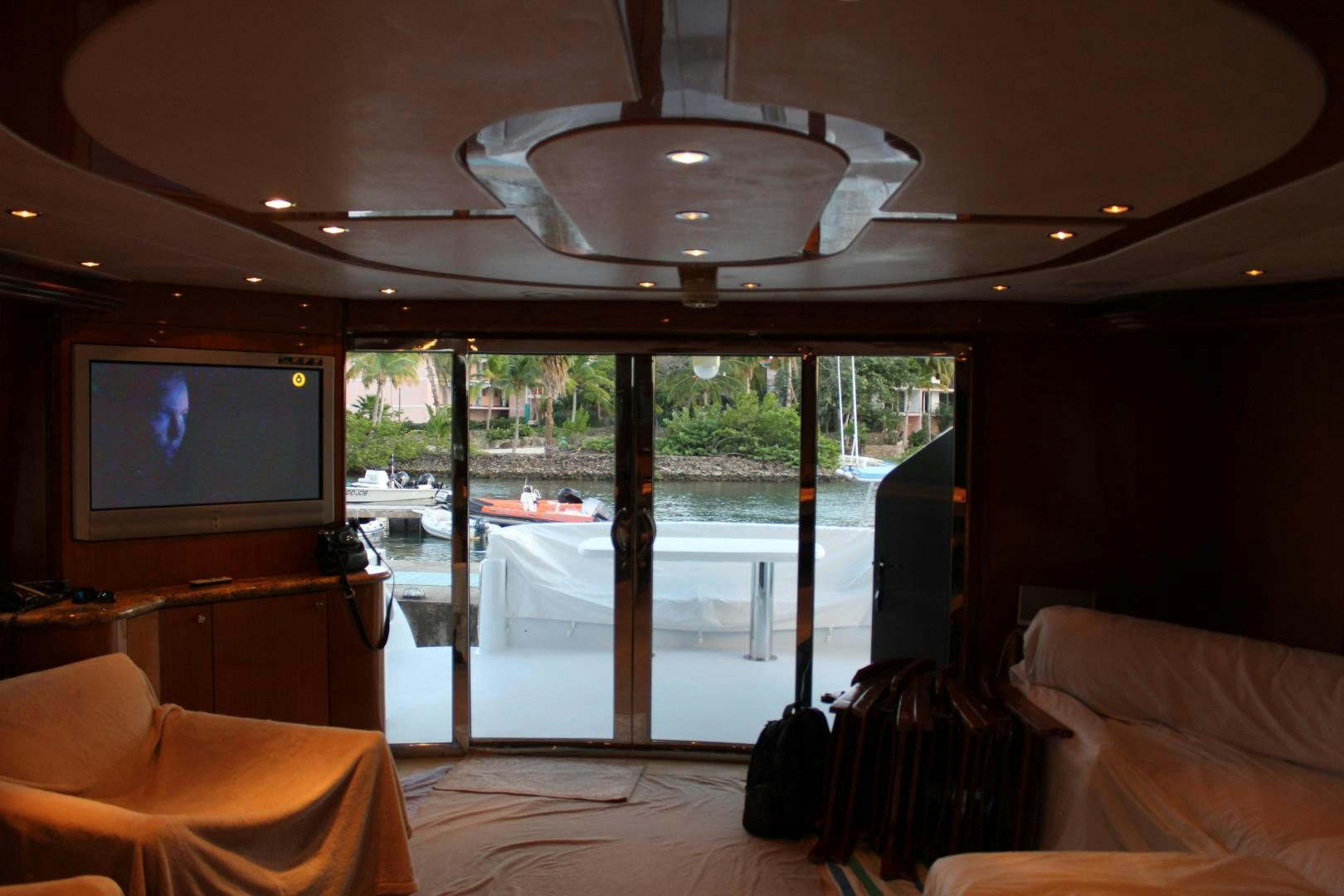 a room with a tv and a bed aboard No Name Yacht for Sale