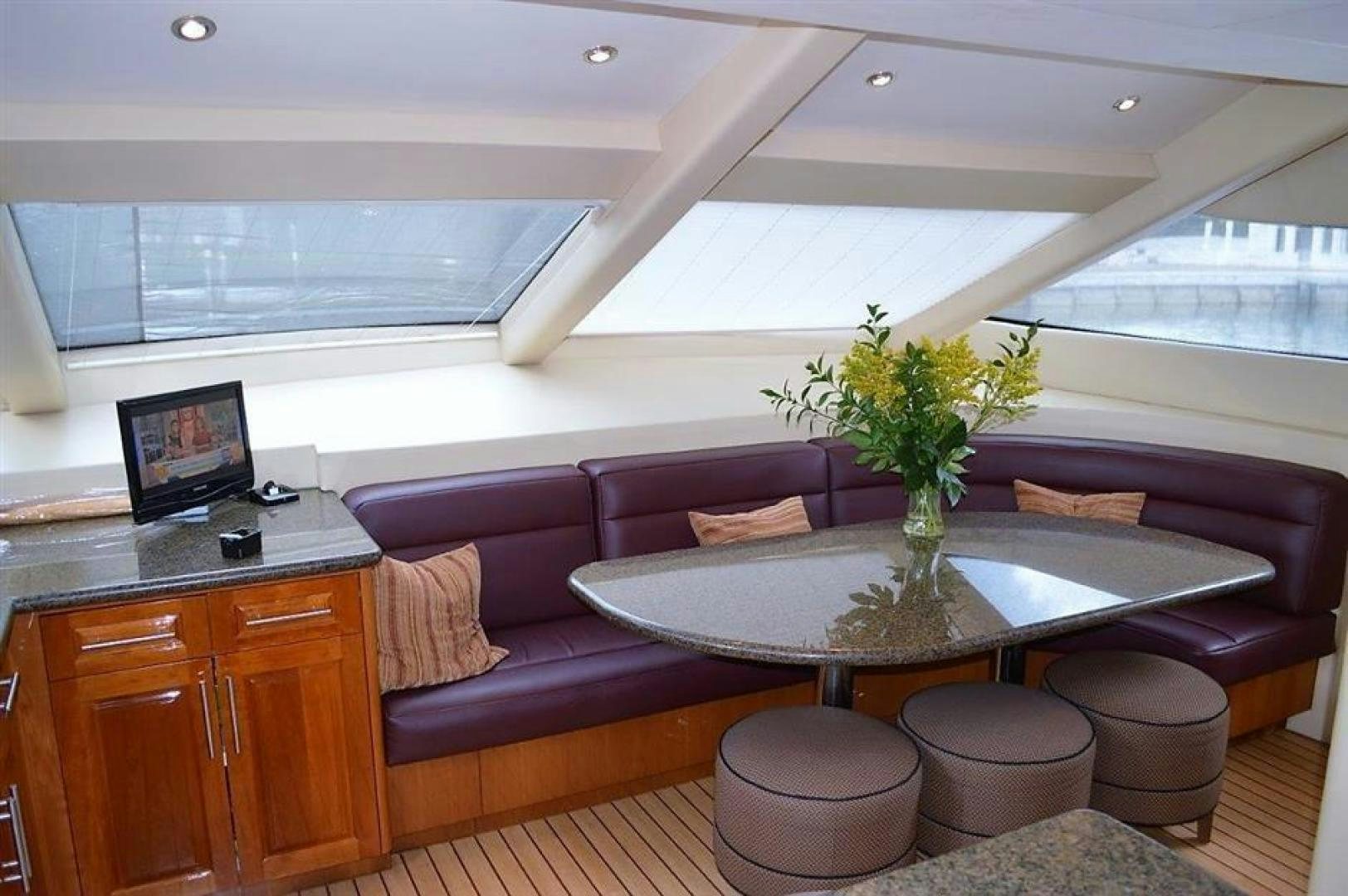 a room with a table and chairs aboard VICTORY Yacht for Sale