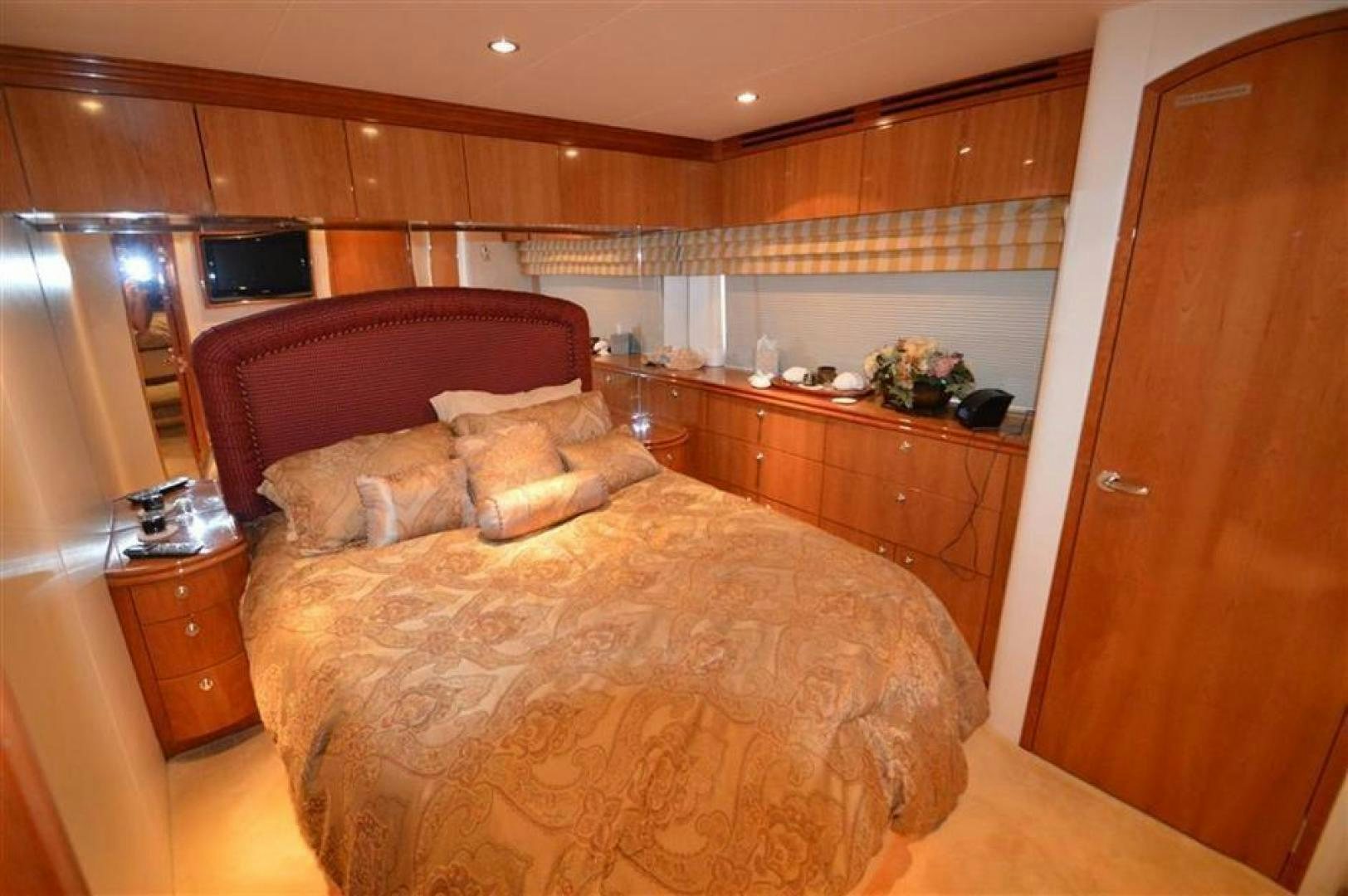 a bedroom with a bed aboard VICTORY Yacht for Sale