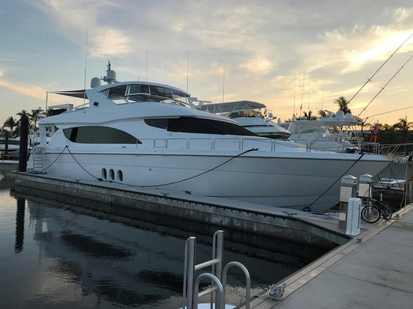 a white yacht docked at a dock aboard VICTORY Yacht for Sale