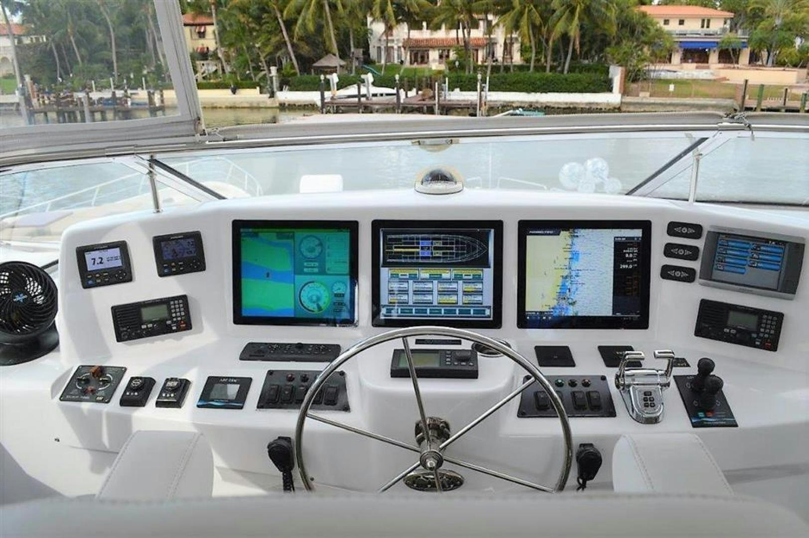 a white bus with windows and screens aboard VICTORY Yacht for Sale