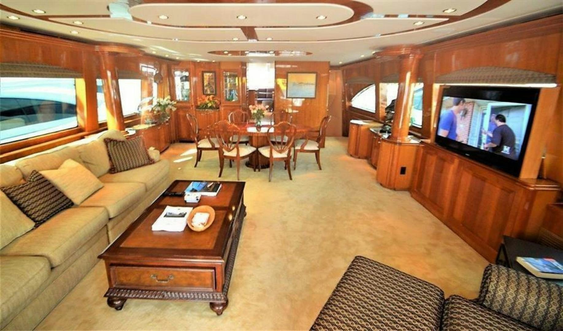 a living room with a tv and a coffee table aboard VICTORY Yacht for Sale