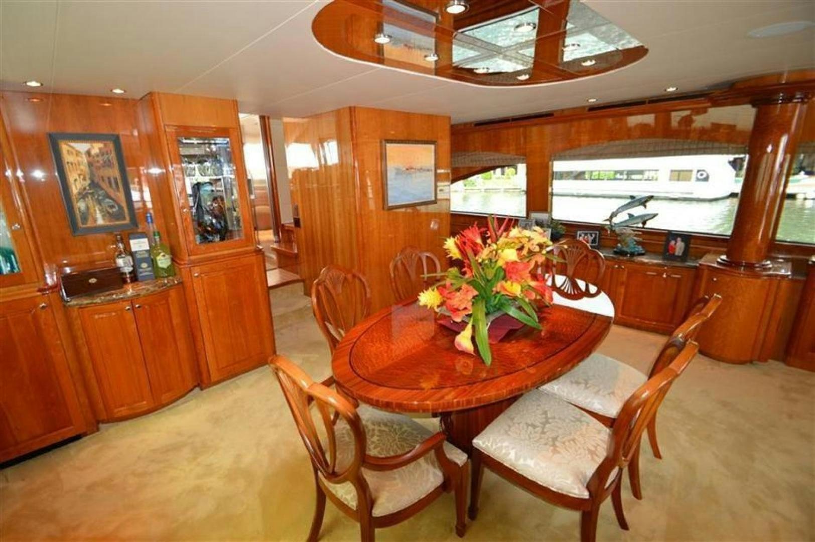 a dining table in a room aboard VICTORY Yacht for Sale
