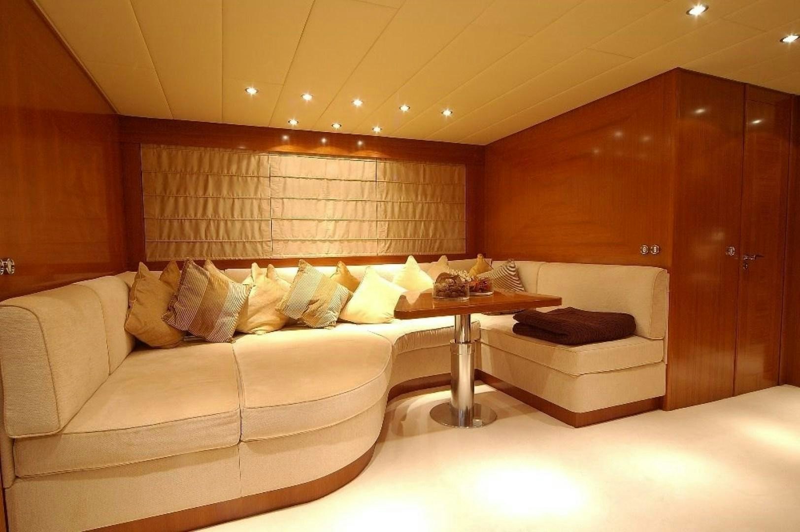 a room with a couch and a table aboard TOBEKA Yacht for Sale