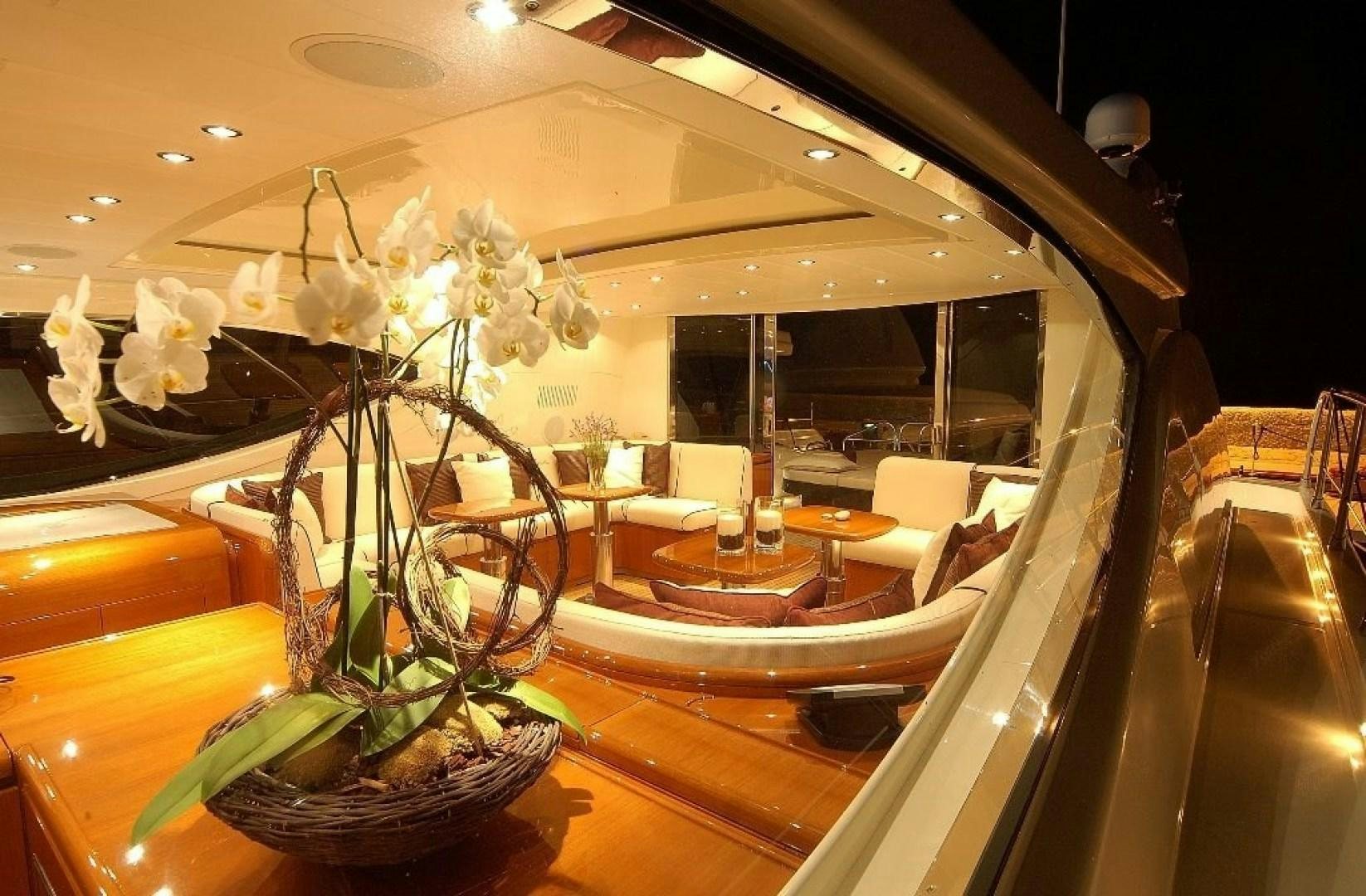 a room with a table and chairs aboard TOBEKA Yacht for Sale