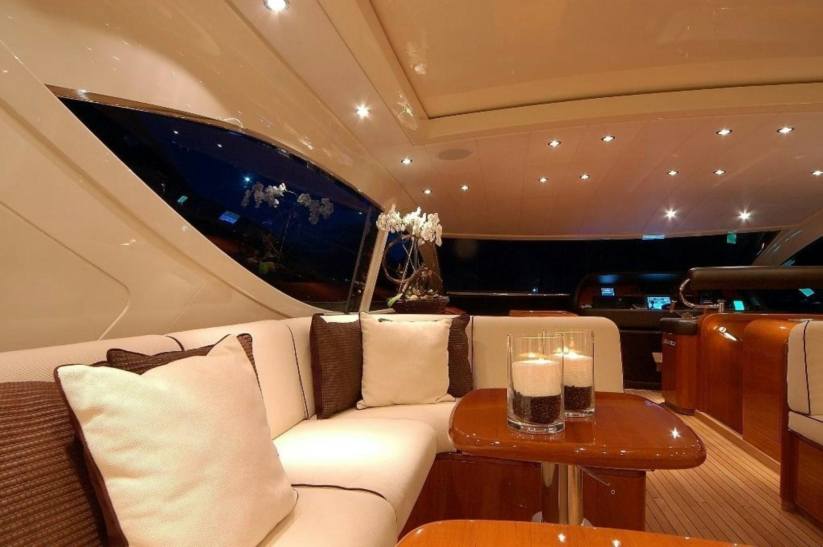 a room with a couch and a table with drinks on it aboard TOBEKA Yacht for Sale