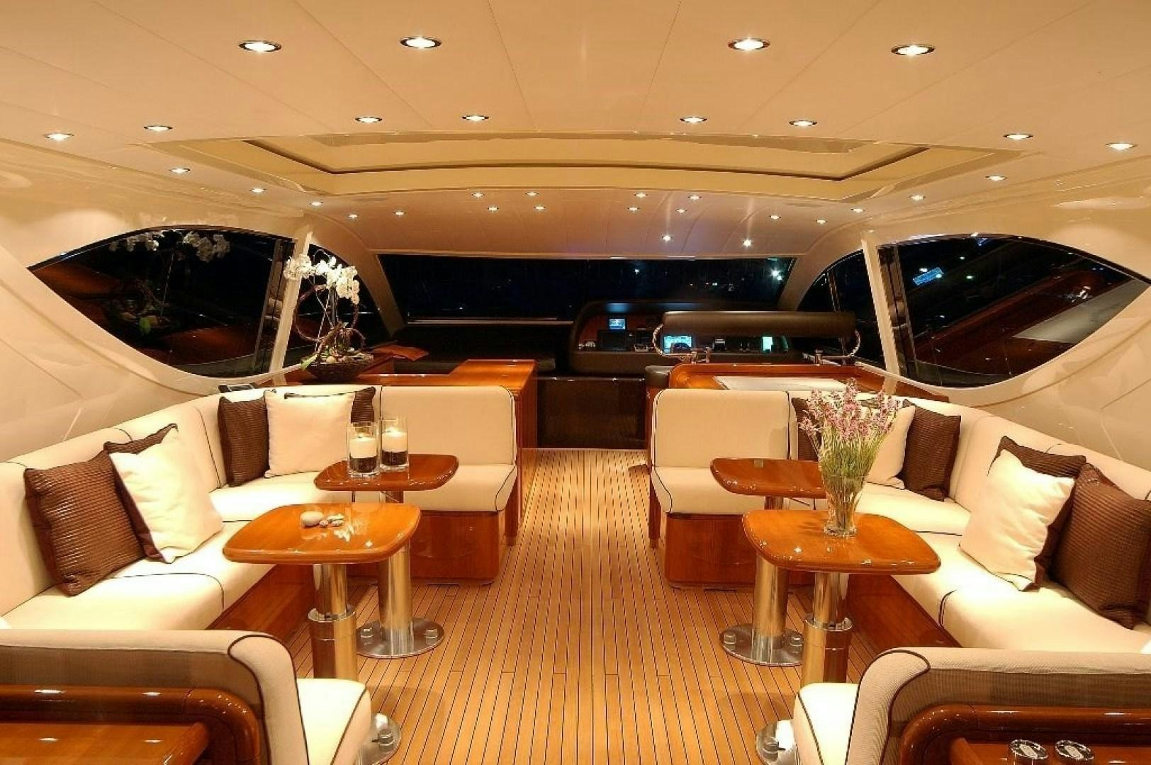 a room with a large sofa and a large fish tank aboard TOBEKA Yacht for Sale