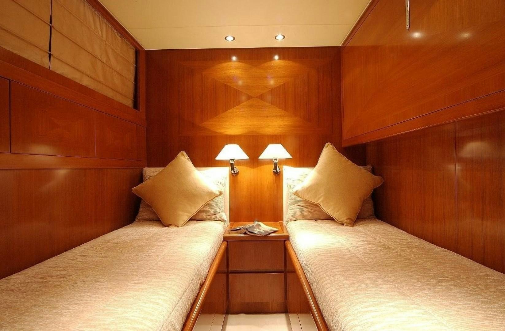 a room with two beds aboard TOBEKA Yacht for Sale