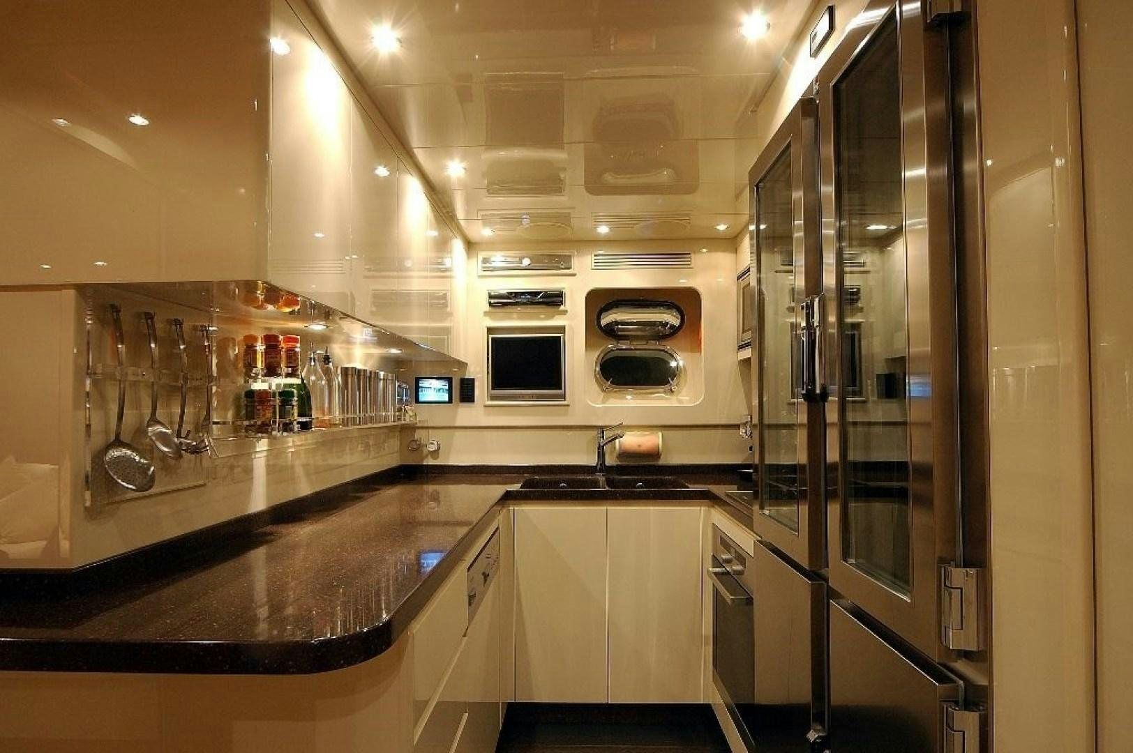 a kitchen with stainless steel appliances aboard TOBEKA Yacht for Sale