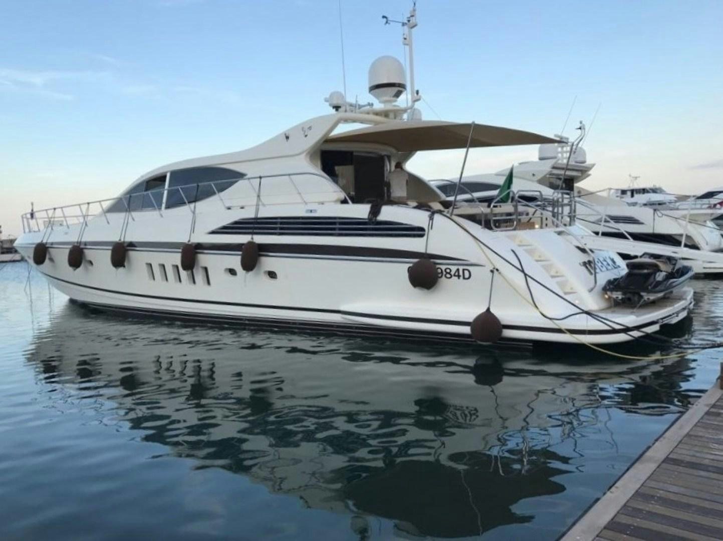 a white yacht docked aboard TOBEKA Yacht for Sale