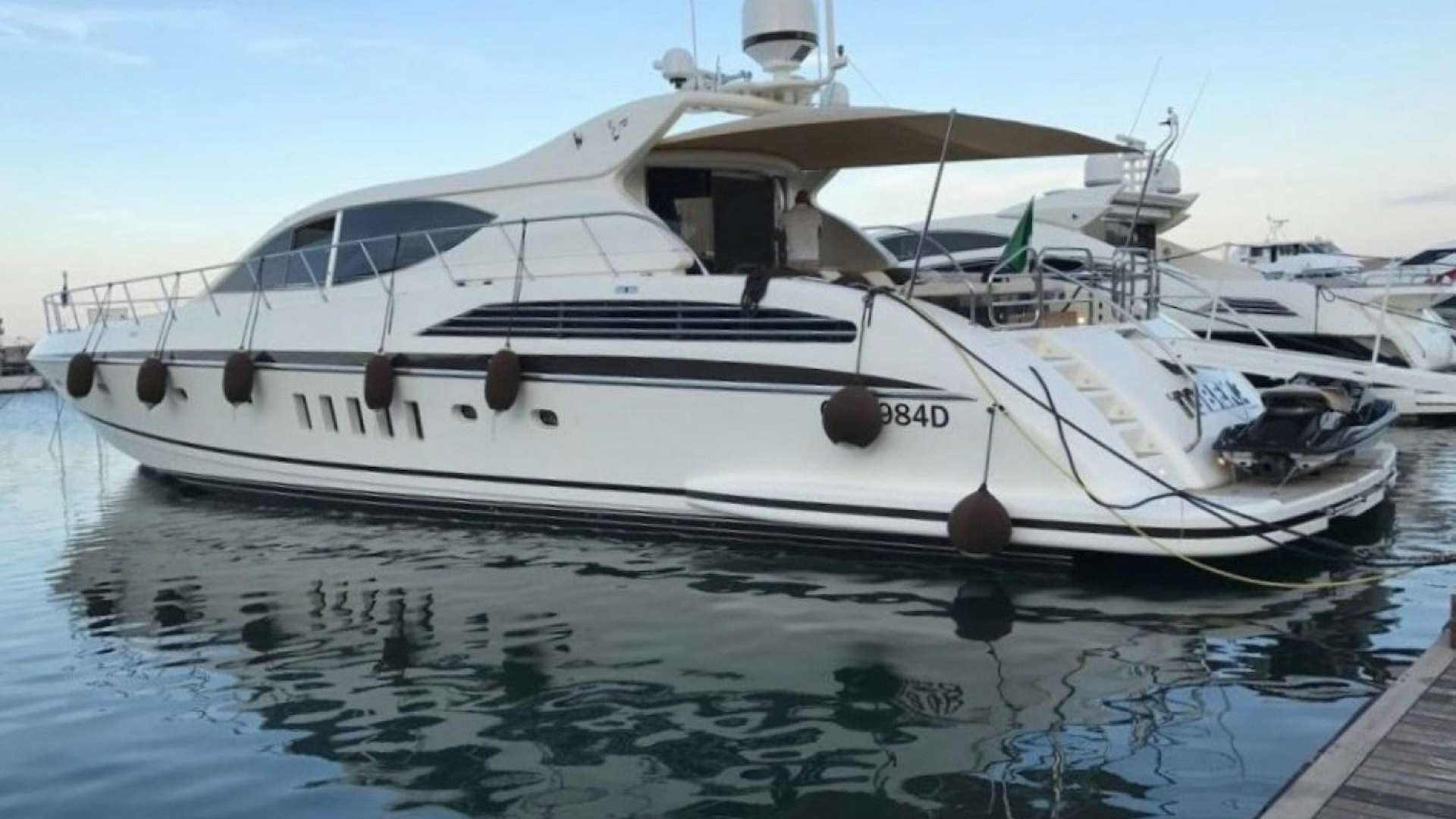 a white yacht docked aboard TOBEKA Yacht for Sale