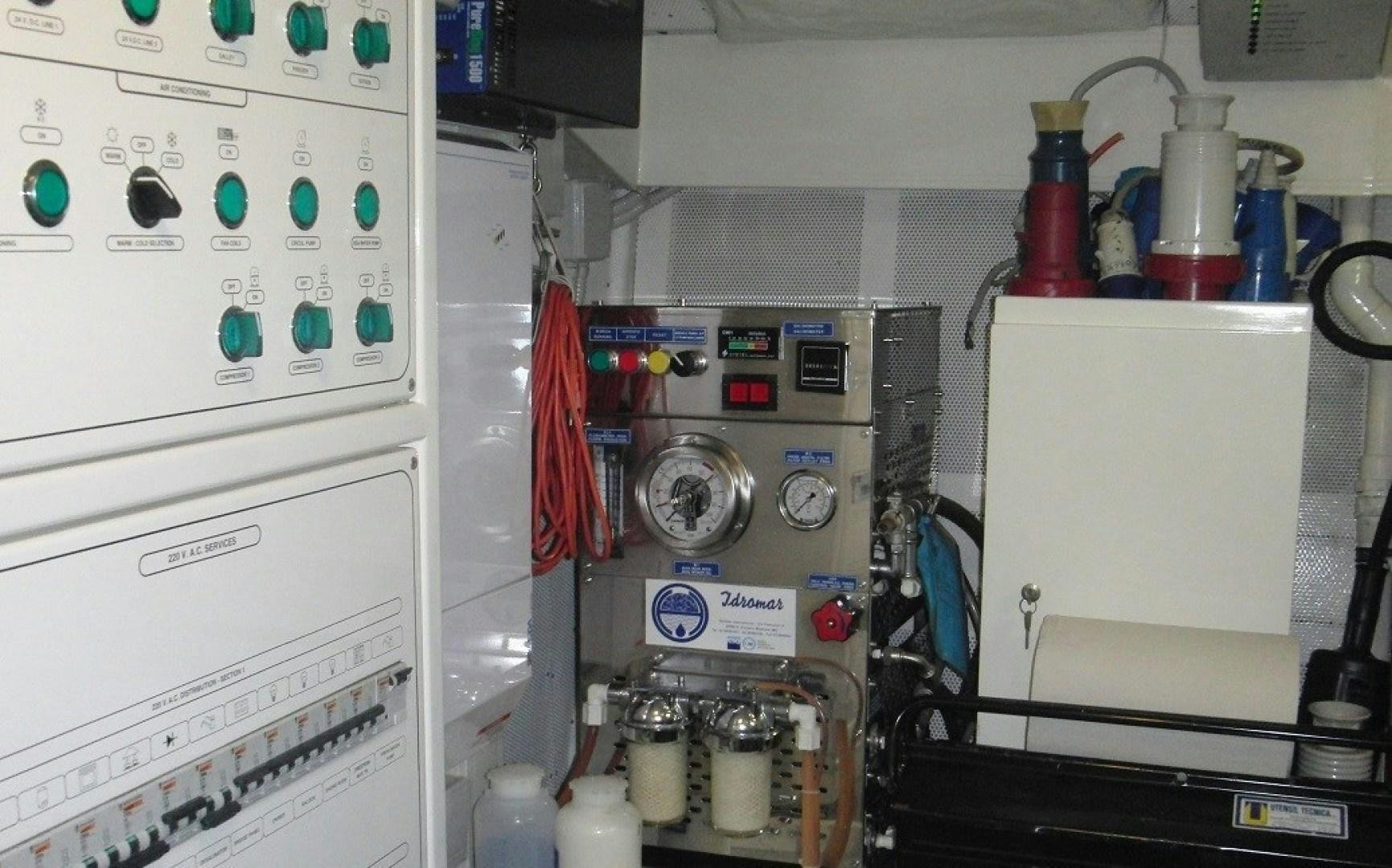 a white refrigerator with a red cloth from it aboard TOBEKA Yacht for Sale