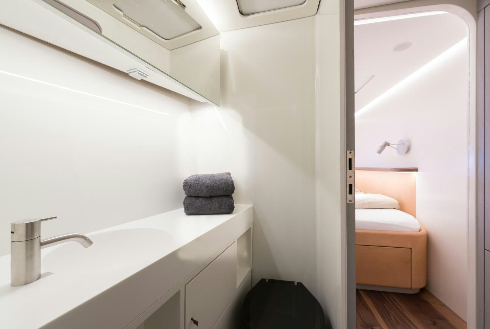 a bathroom with a sink and a mirror aboard cool breeze Yacht for Sale