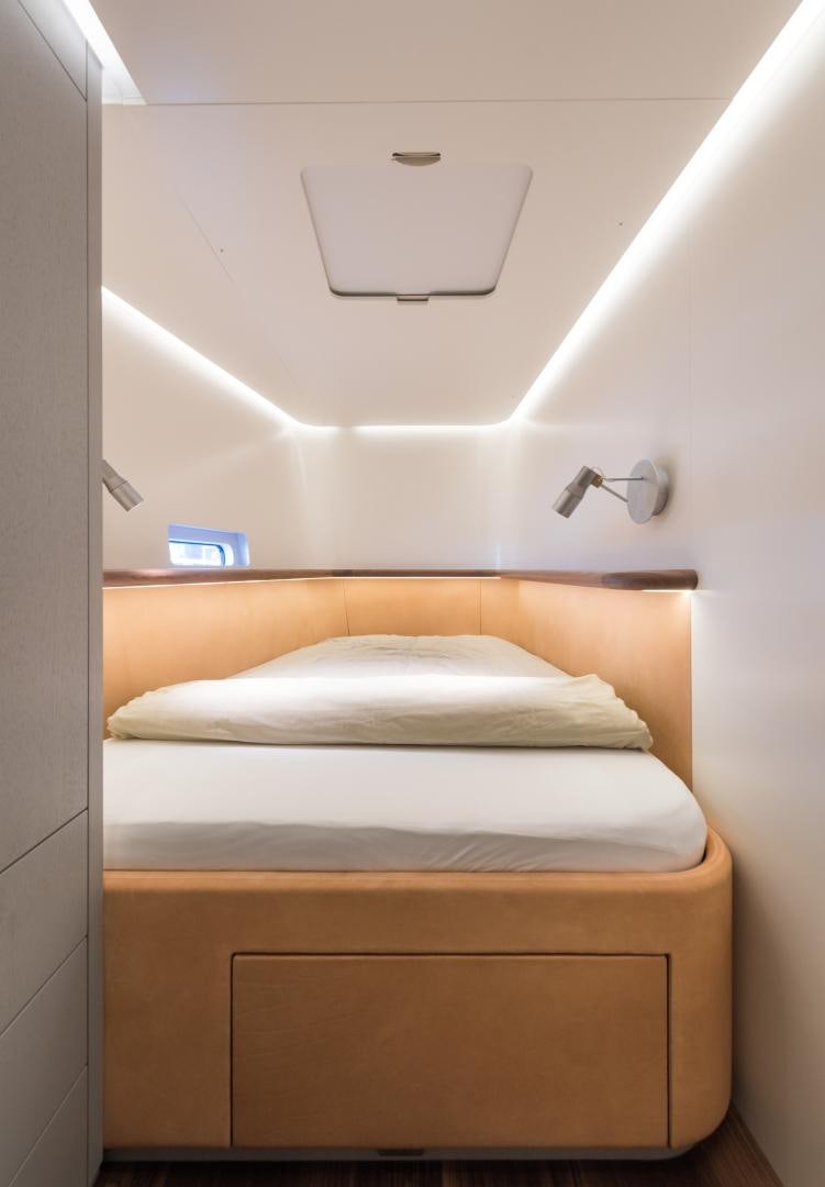 a room with a bed and a light aboard cool breeze Yacht for Sale