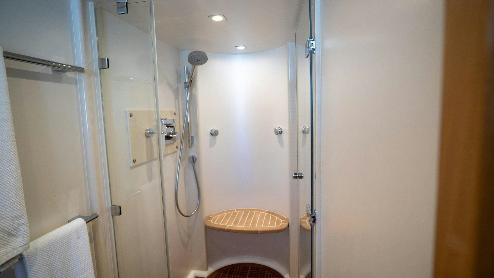 a bathroom with a shower and a toilet aboard OCHO UNO Yacht for Sale