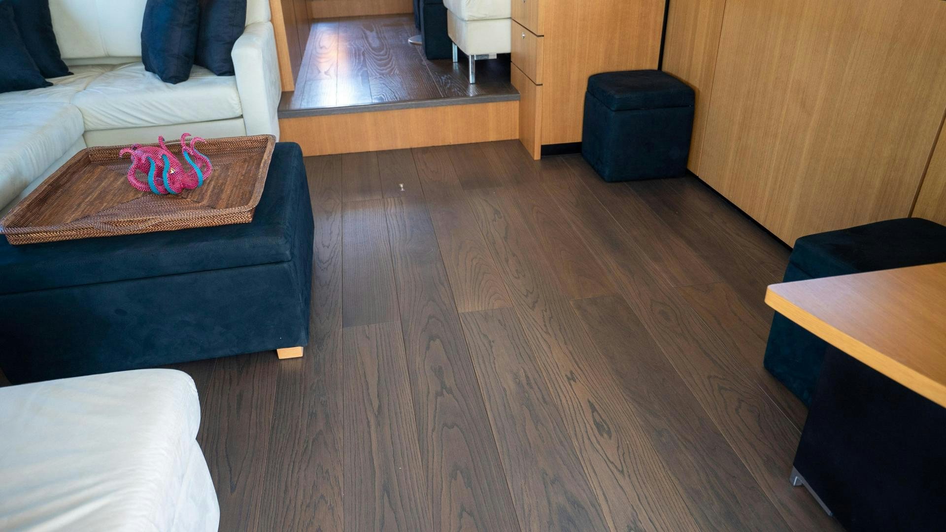 a room with a couch and a table aboard OCHO UNO Yacht for Sale