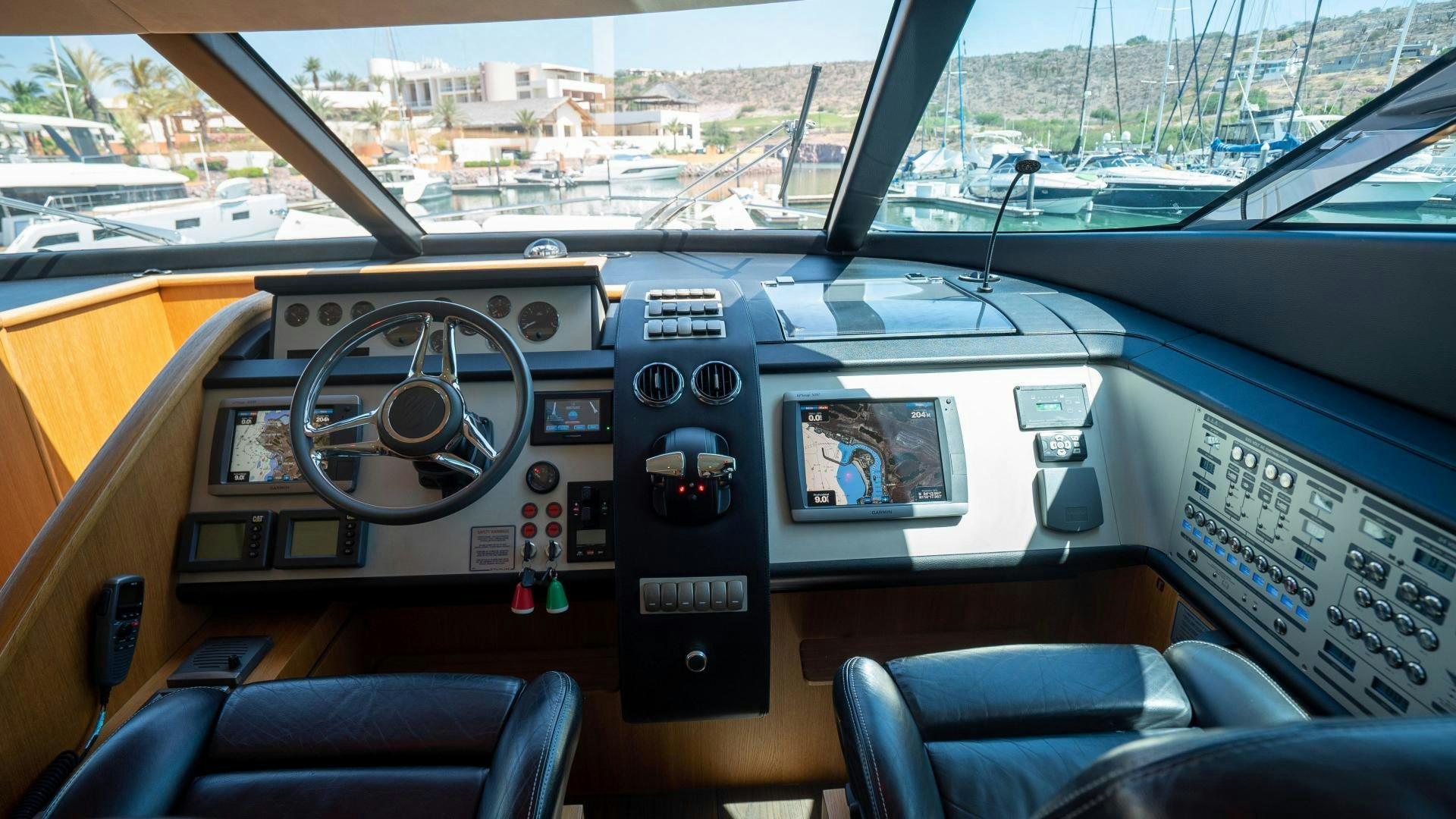 inside of a car aboard OCHO UNO Yacht for Sale