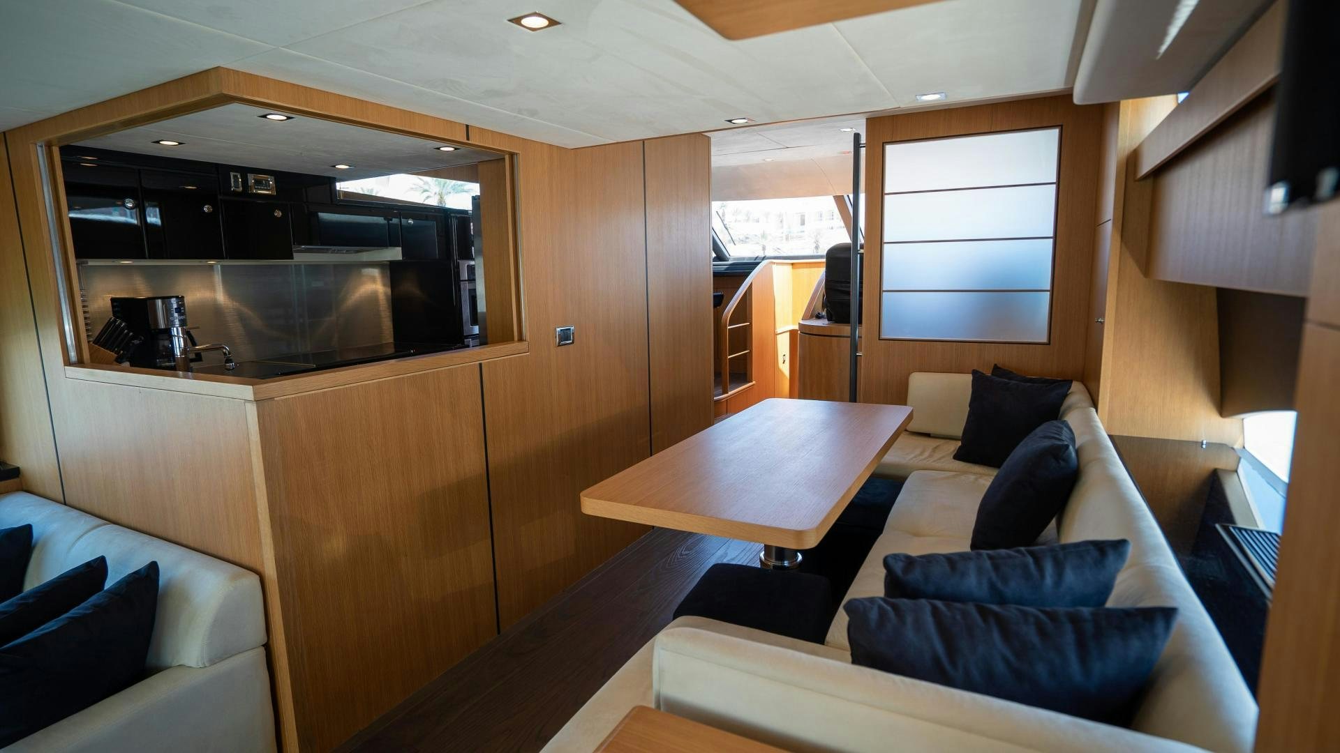 a room with a couch and a table aboard OCHO UNO Yacht for Sale
