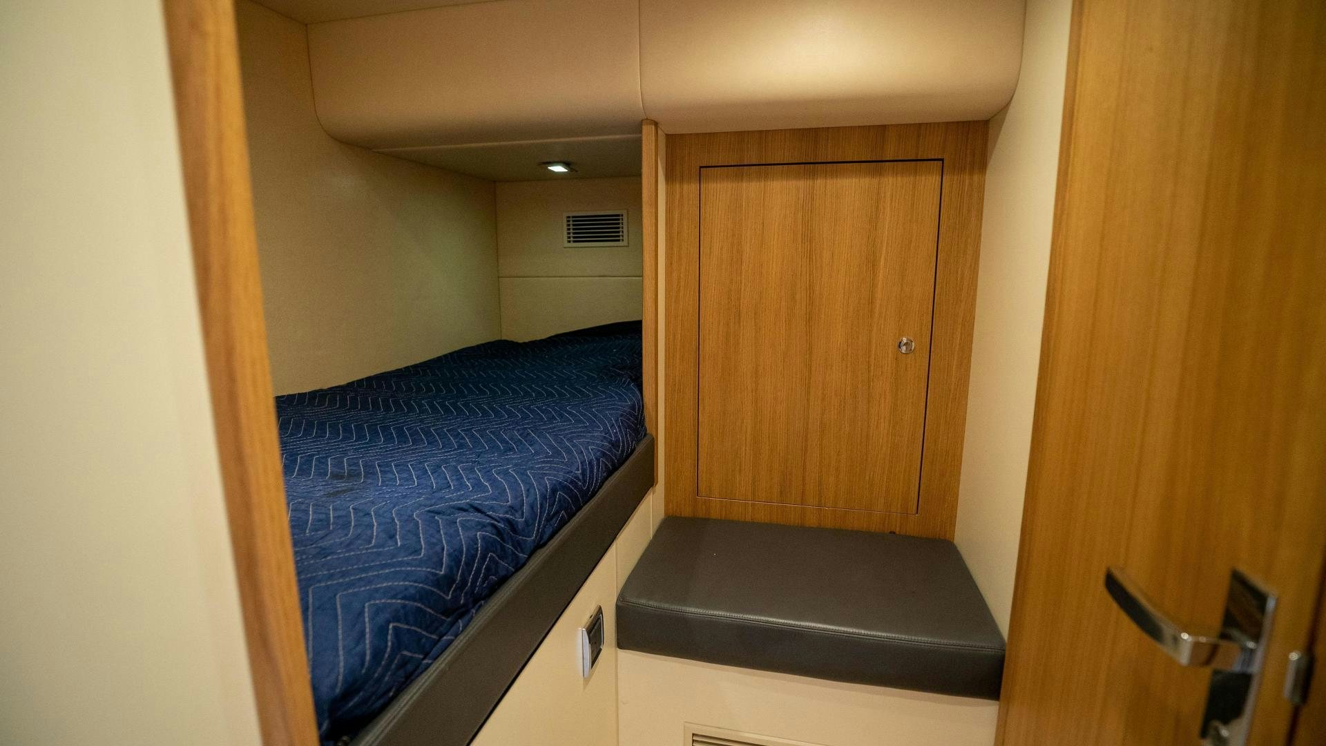 a bedroom with a bed aboard OCHO UNO Yacht for Sale