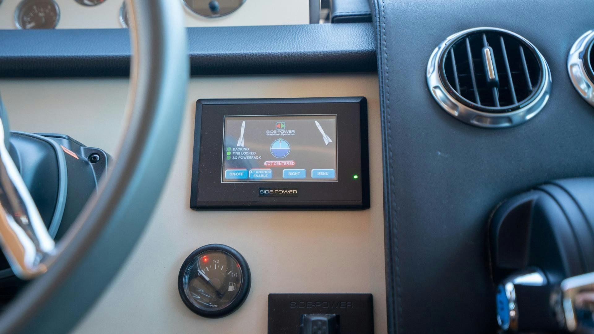 a close-up of a car dashboard aboard OCHO UNO Yacht for Sale