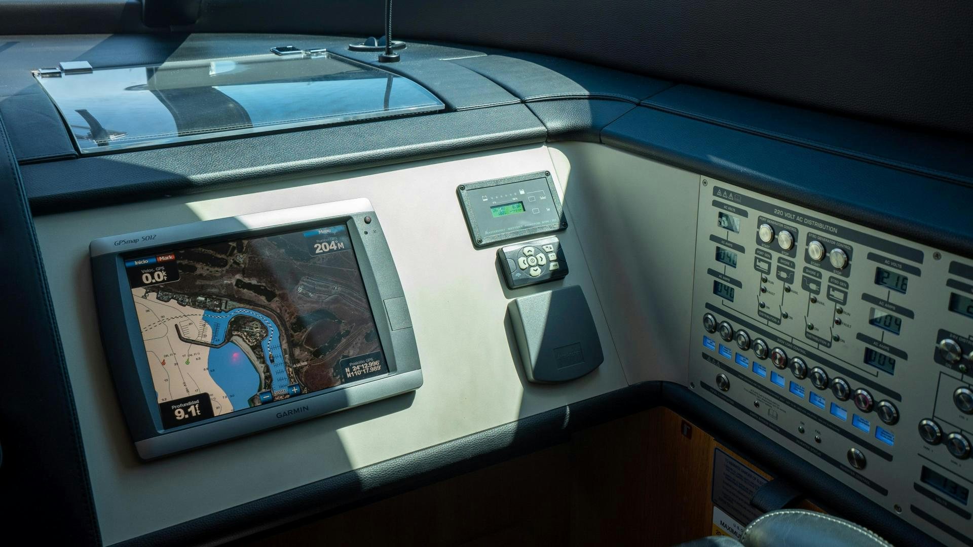 a video game console and a console aboard OCHO UNO Yacht for Sale