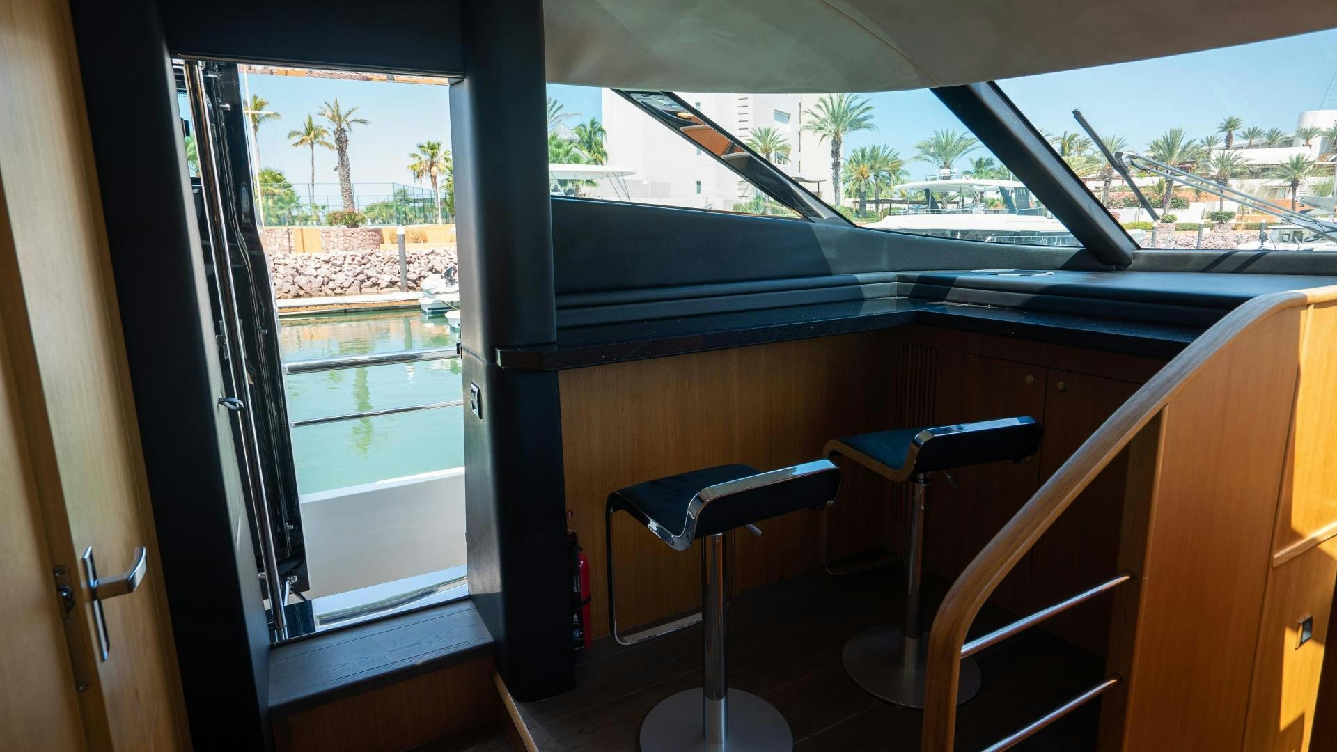 a room with a desk and a window aboard OCHO UNO Yacht for Sale