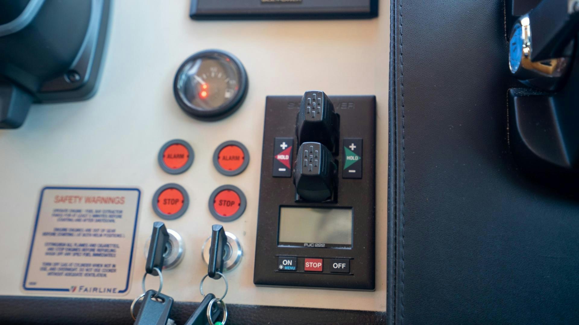 a black rectangular object with red buttons aboard OCHO UNO Yacht for Sale