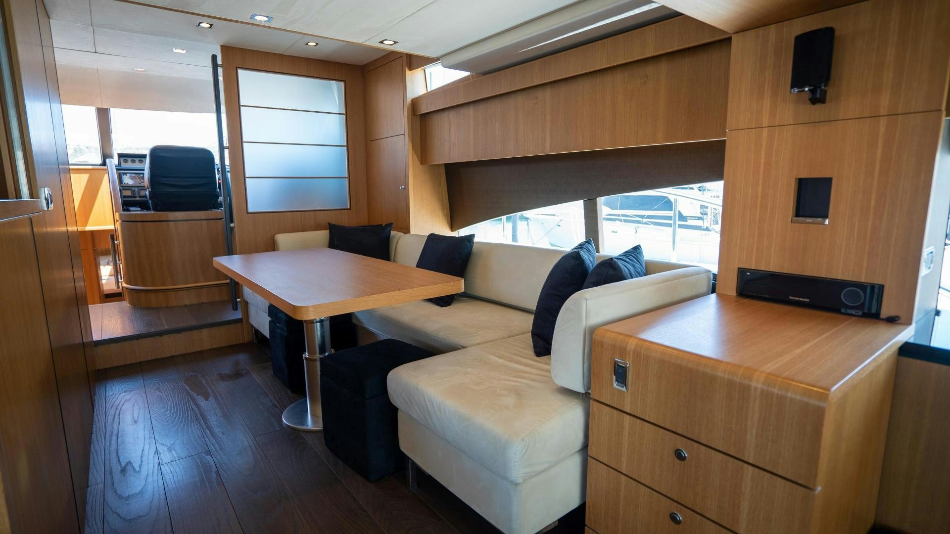 a room with a couch and a table aboard OCHO UNO Yacht for Sale