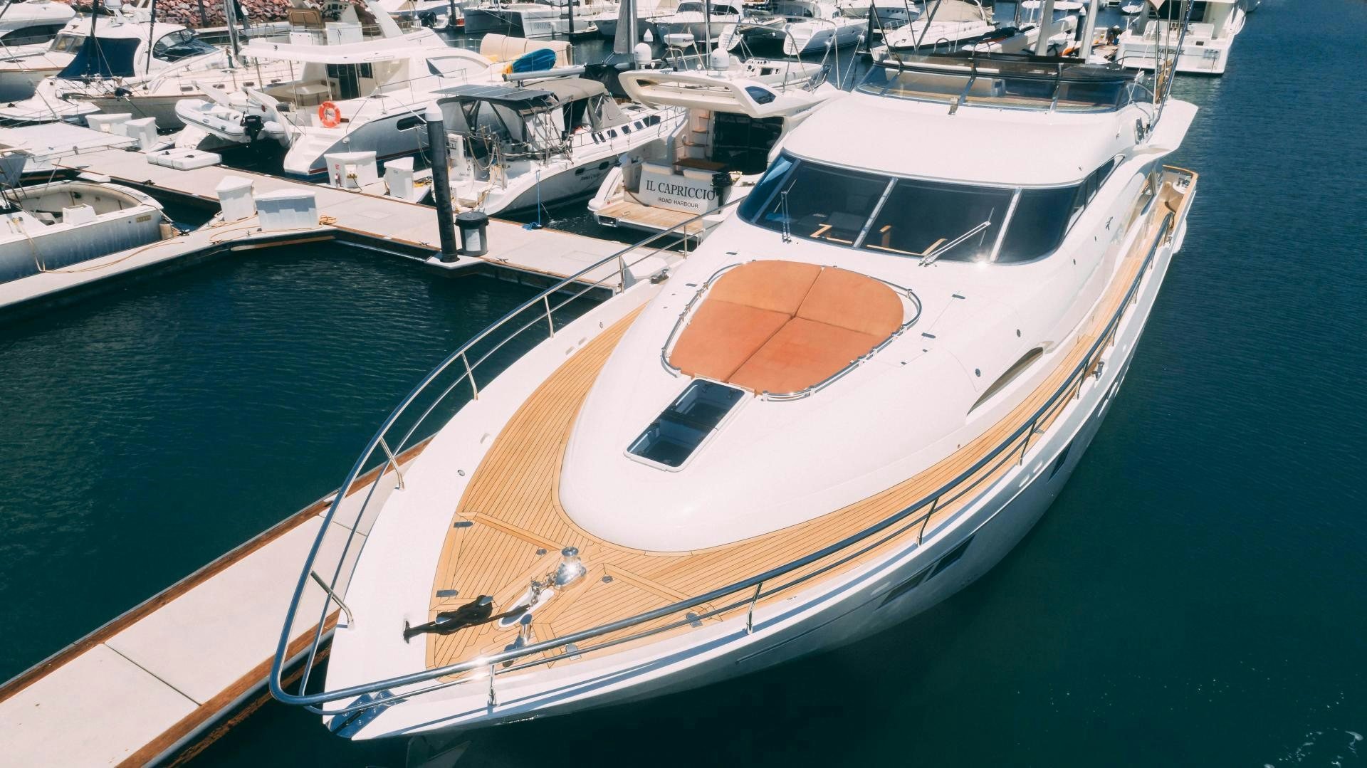 a boat docked at a pier aboard OCHO UNO Yacht for Sale