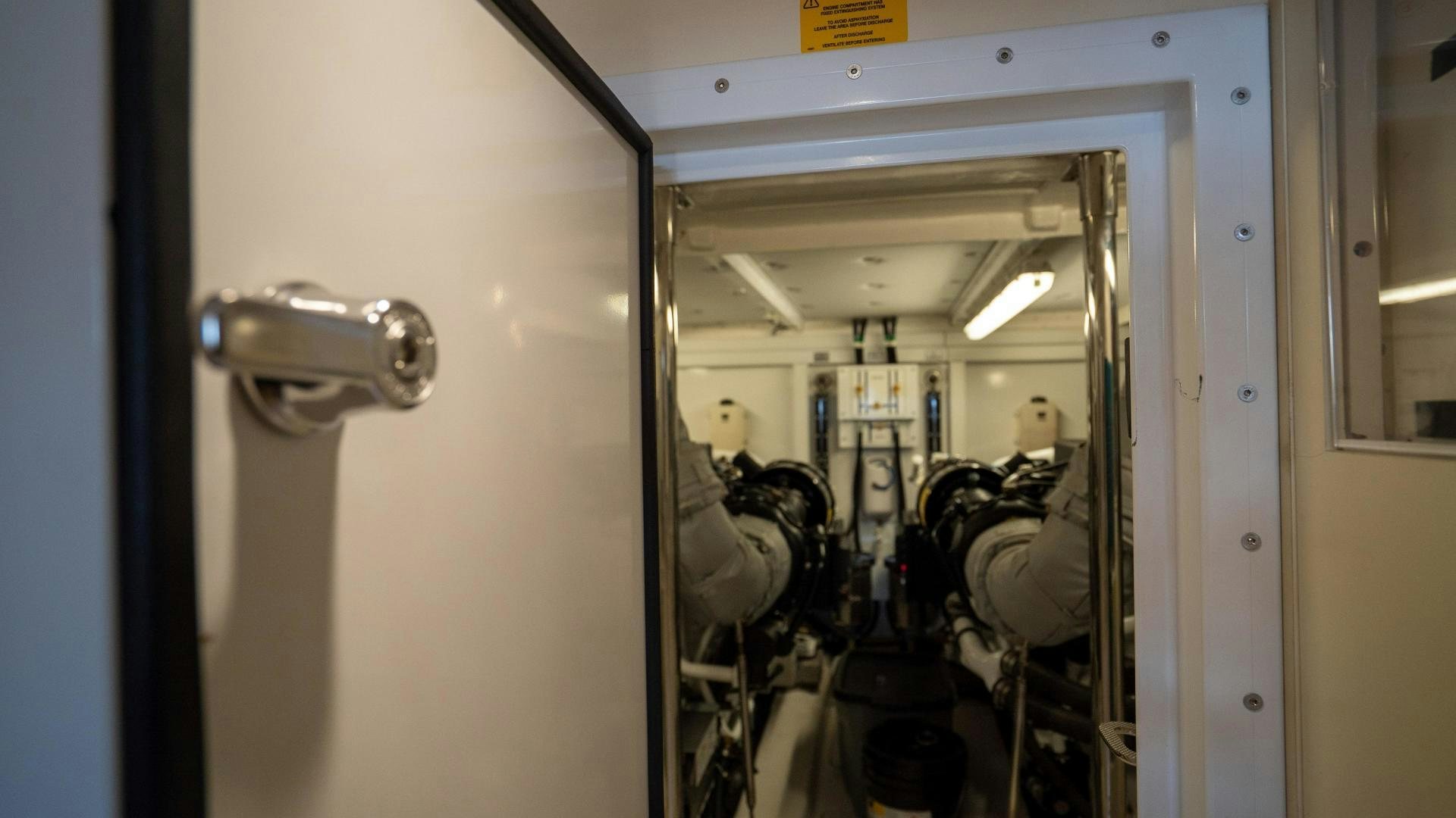 a door with a group of people inside aboard OCHO UNO Yacht for Sale