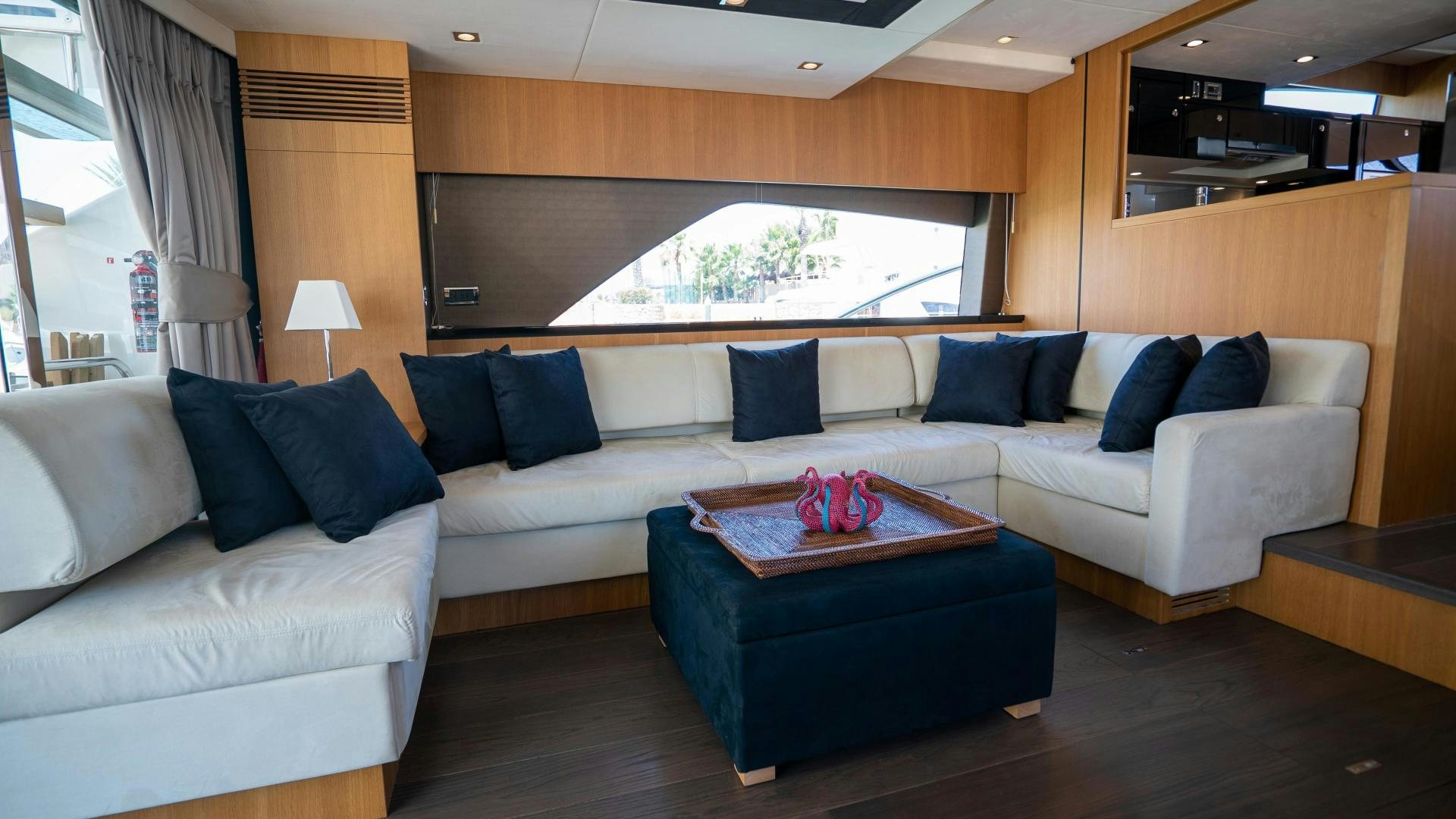 a living room with a couch and a coffee table aboard OCHO UNO Yacht for Sale