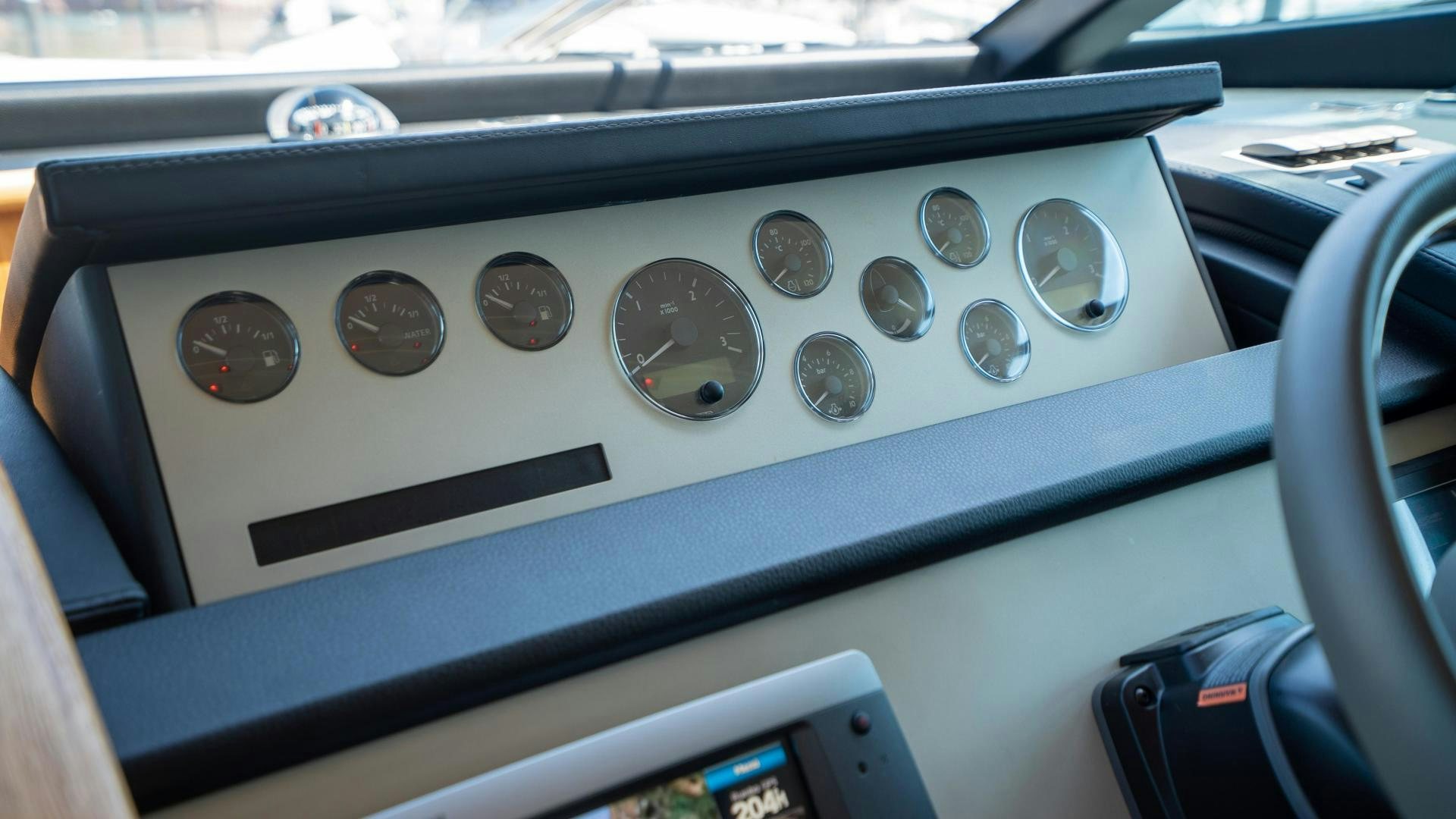 the inside of a car aboard OCHO UNO Yacht for Sale