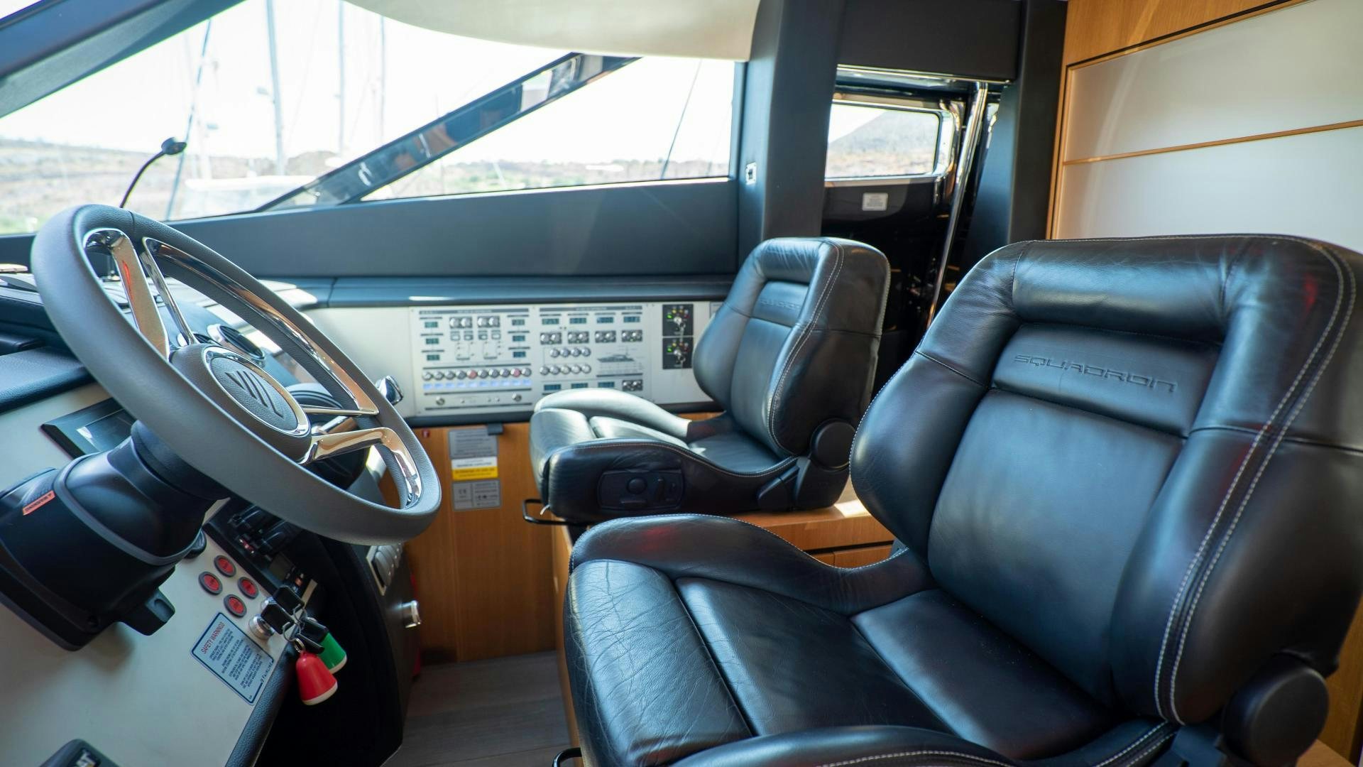 the inside of a car aboard OCHO UNO Yacht for Sale