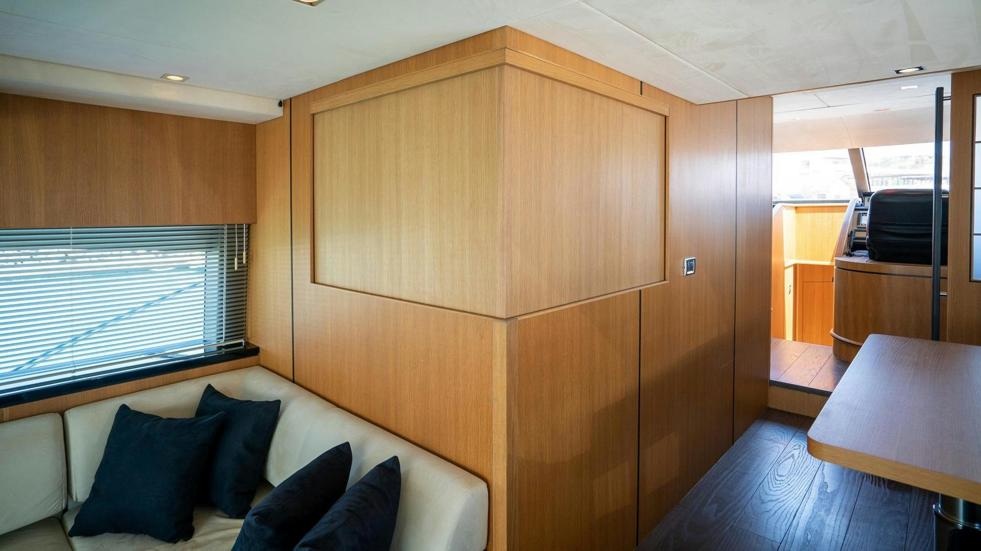a room with a couch and a table aboard OCHO UNO Yacht for Sale
